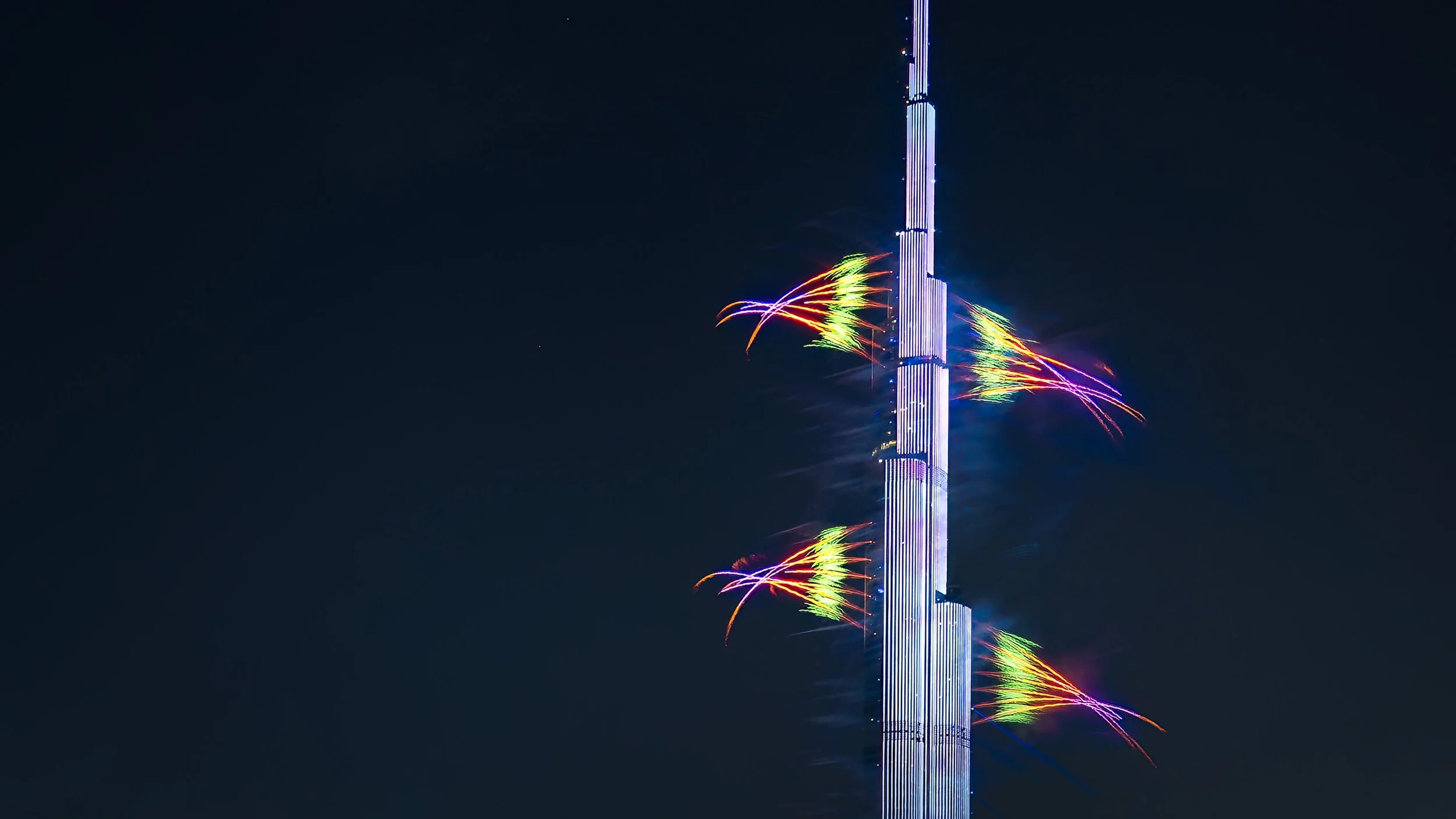 Burj Khalifa New Year's Eve light and fireworks show close-up colorful shot - Emaar Dubai — fine art photograph by Ahmad Alnaji, SARAB Art Production