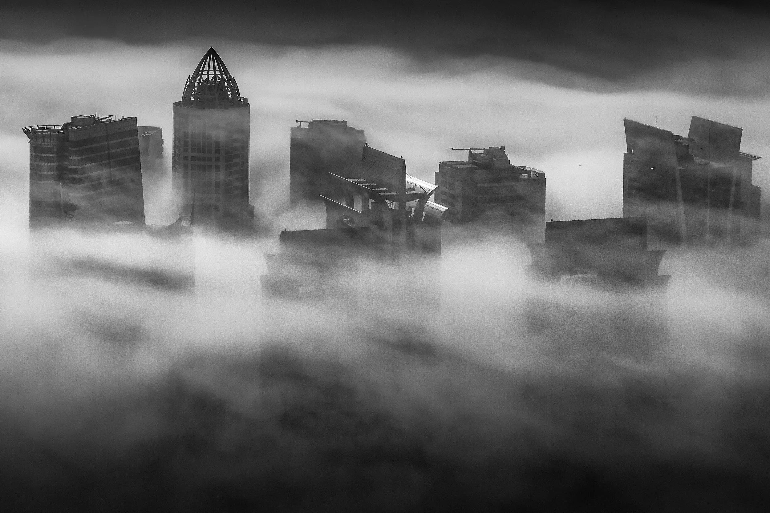 jlt-skyscrapers-piercing-dense-fog-dubai-sarab-ahmad-alnaji.jpg