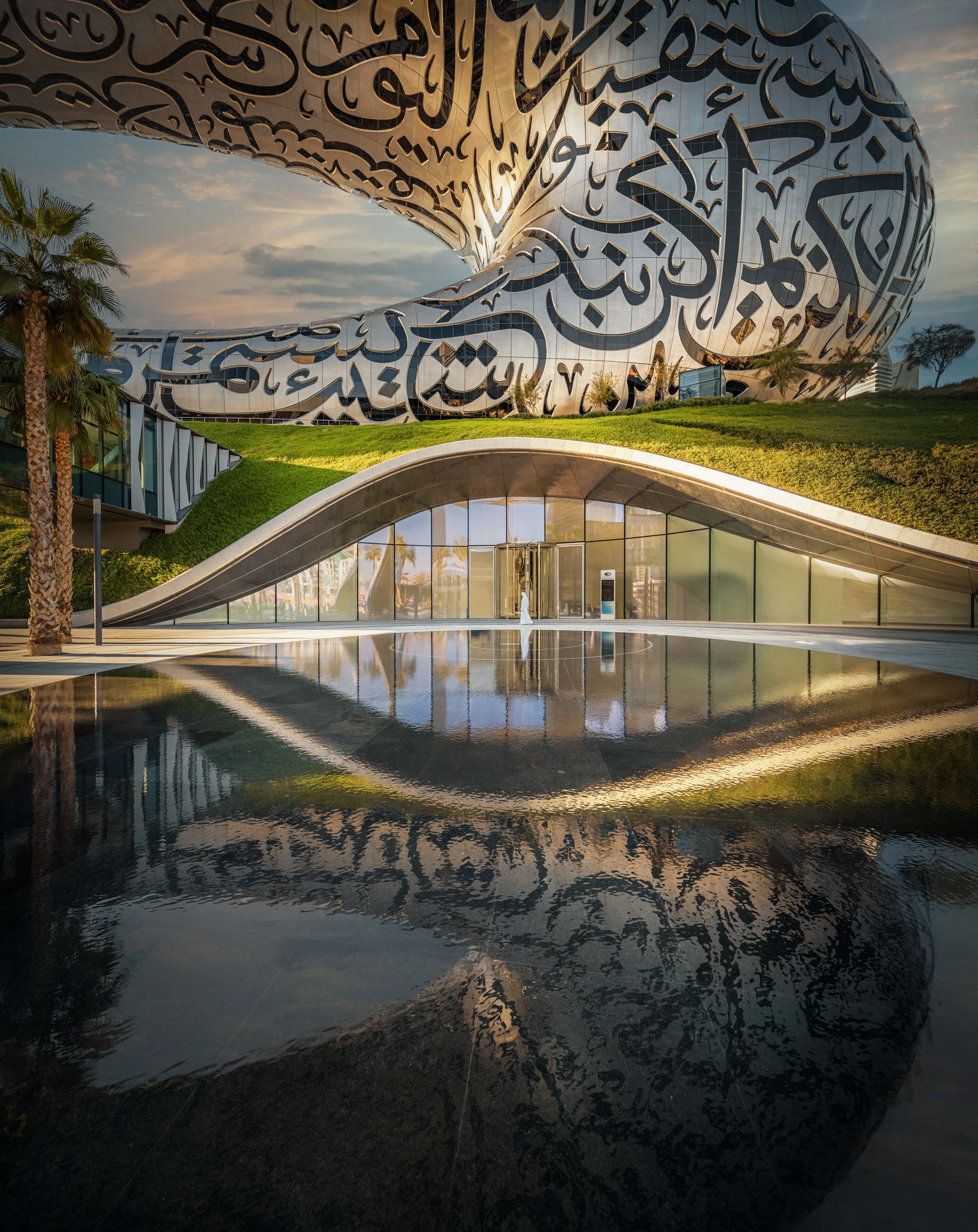 Museum of the Future daytime exterior with reflection pool and landscaped gardens, Dubai — fine art architectural photograph by Ahmad Alnaji, SARAB Art Production