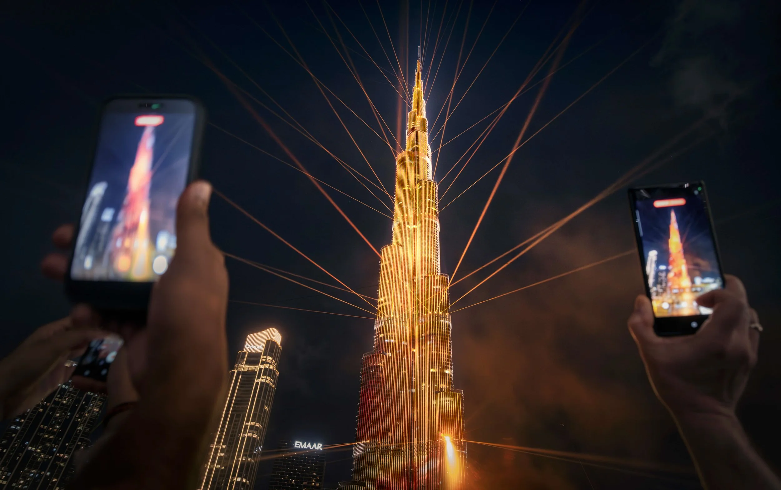 Burj Khalifa light spectacular produced by Knvat with multicolored illumination, Emaar Properties Dubai — fine art photograph by Ahmad Alnaji, SARAB Art Production