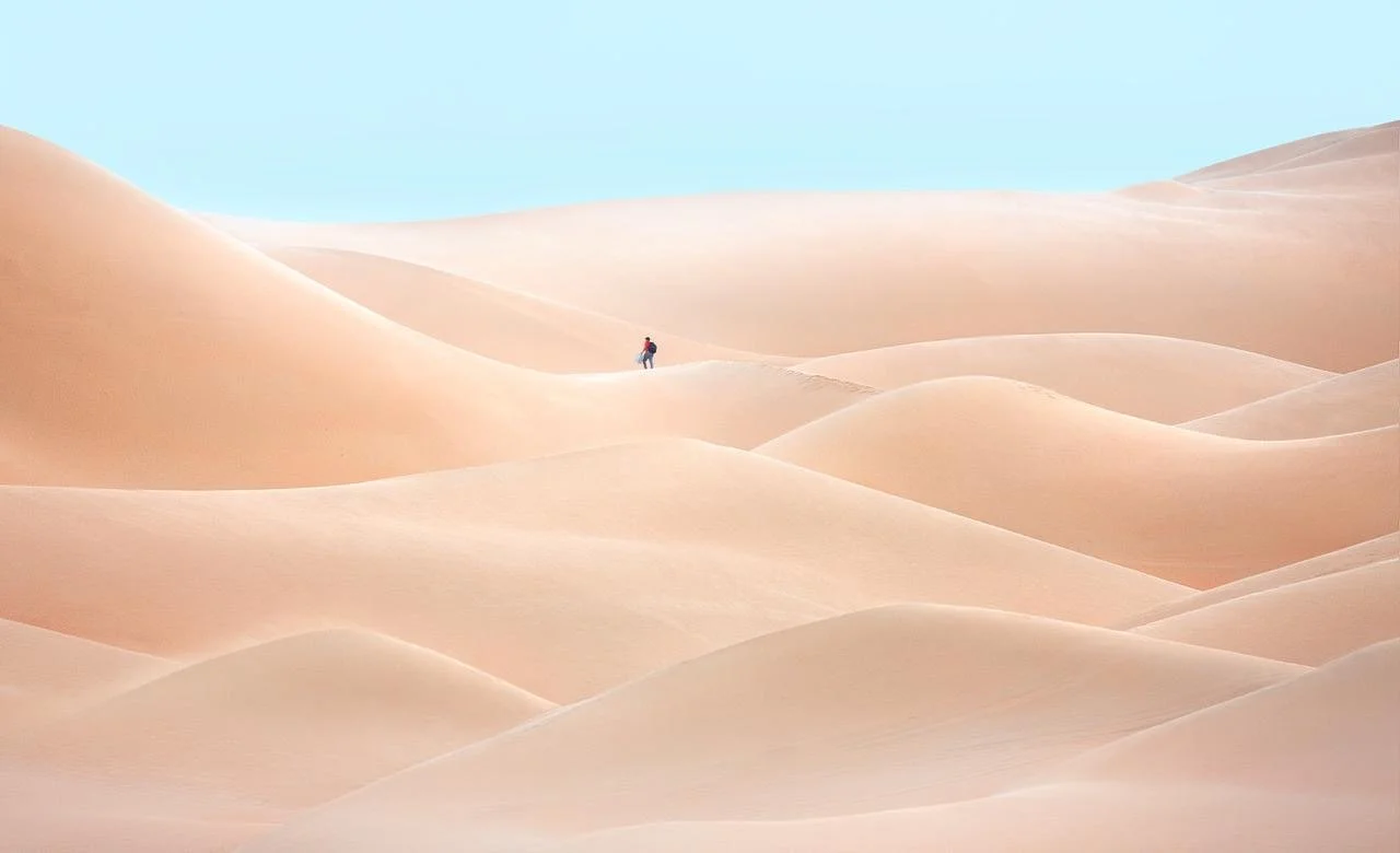 inimalist-person-walking-vast-desert-dunes-uae-sarab.JPG