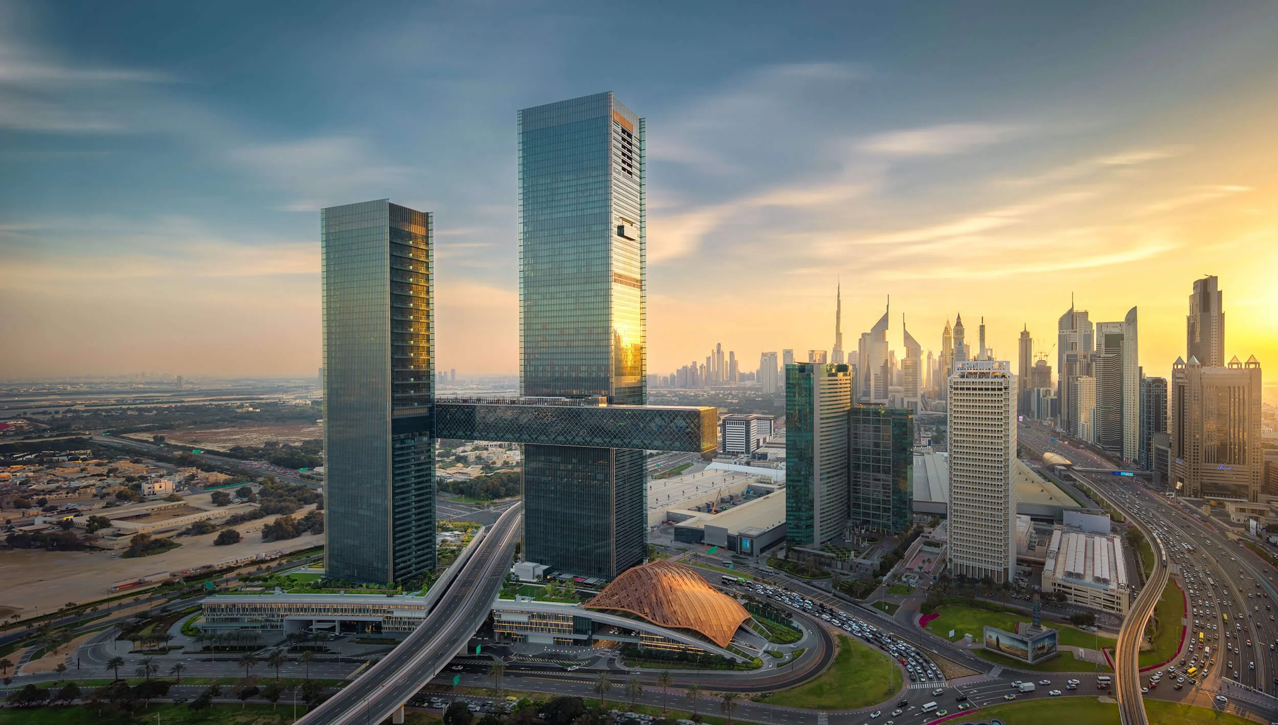One Za'abeel at sunset with Dubai skyline behind it, designed by Nikken Sekkei, Japan — fine art architectural photograph by Ahmad Alnaji, SARAB Art Production