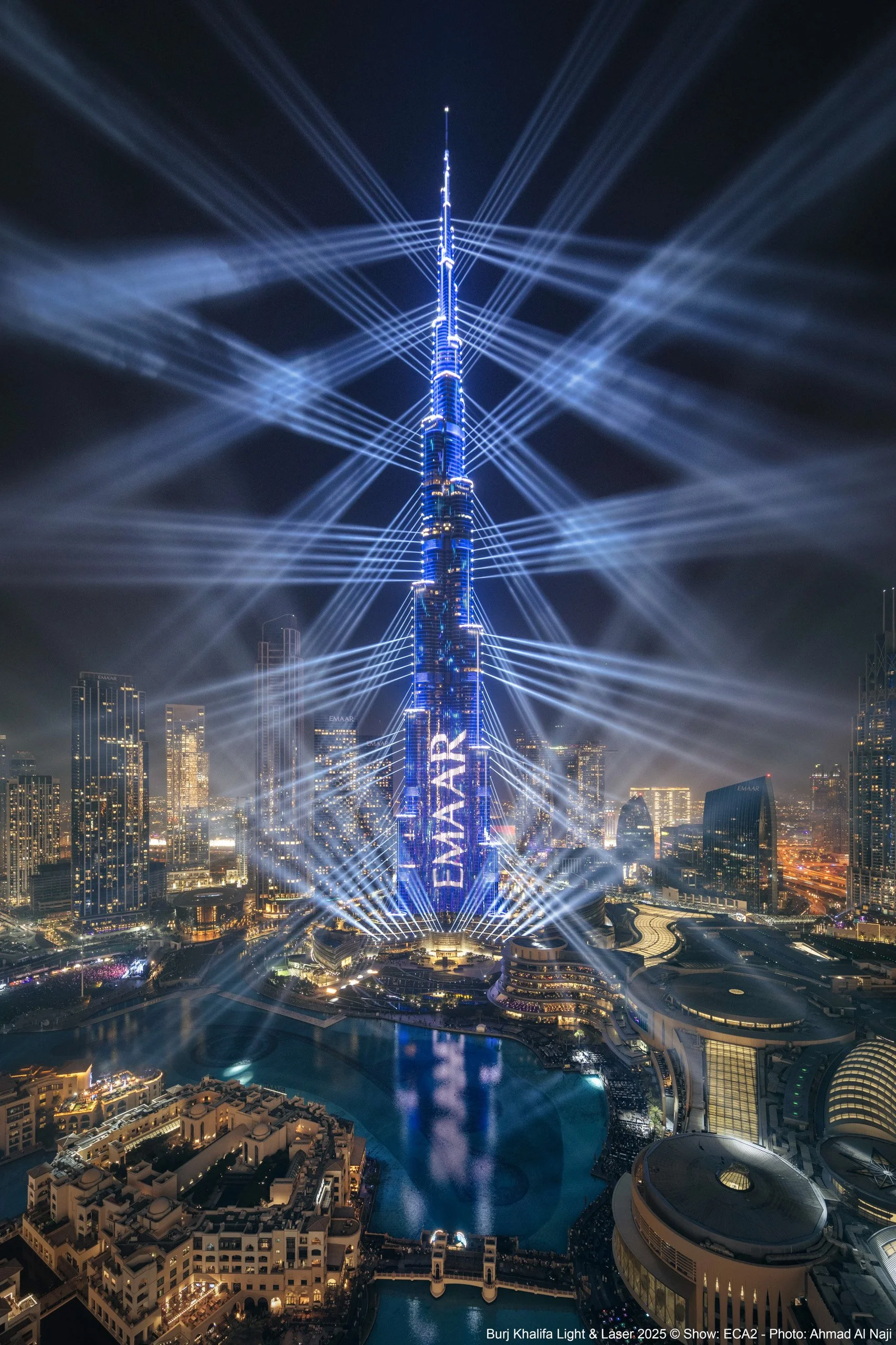 Burj Khalifa spectacular light show produced by Eca2, with Emaar Properties logo shown in Downtown Dubai, SOM architecture — fine art photograph by Ahmad Alnaji, SARAB Art Production