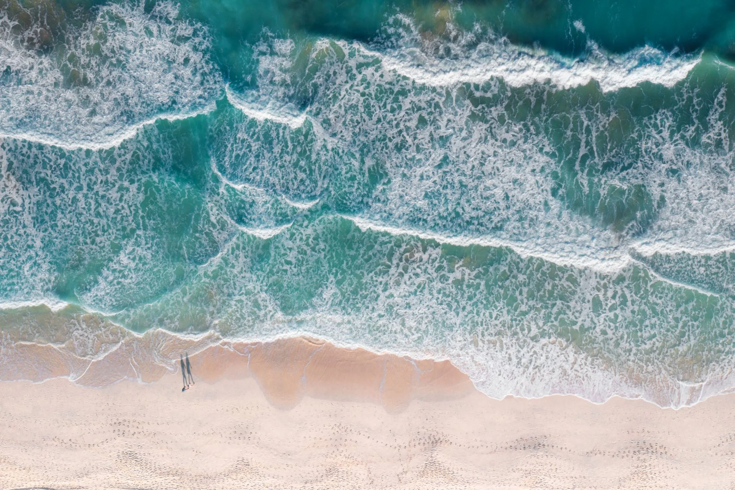 aerial-top-down-turquoise-ocean-waves-sandy-beach-uae-abu-dhabi-sarab.jpg