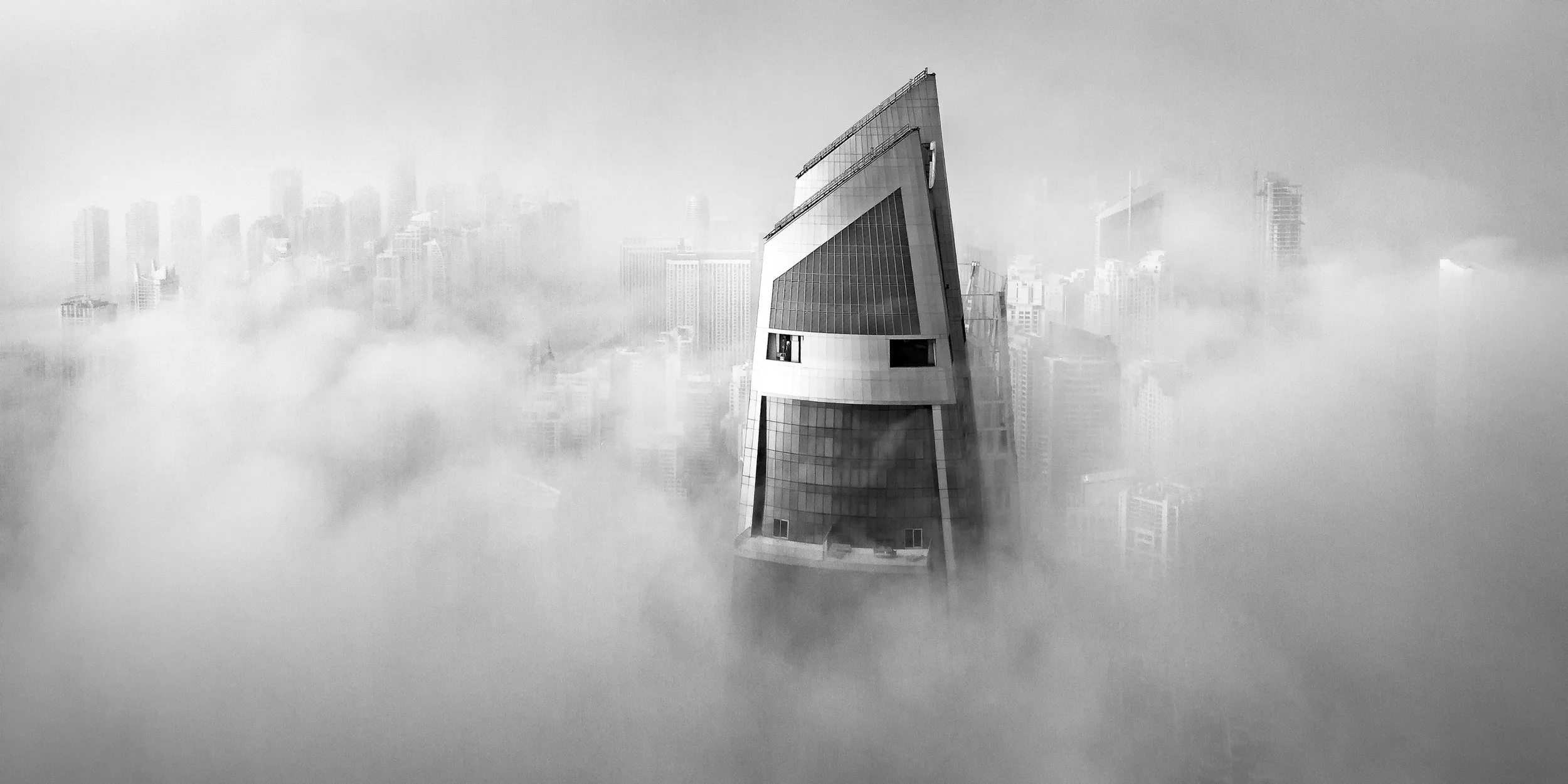 sarab-ahmad-alnaji-modern-skyscraper-piercing-fog-dubai.jpg