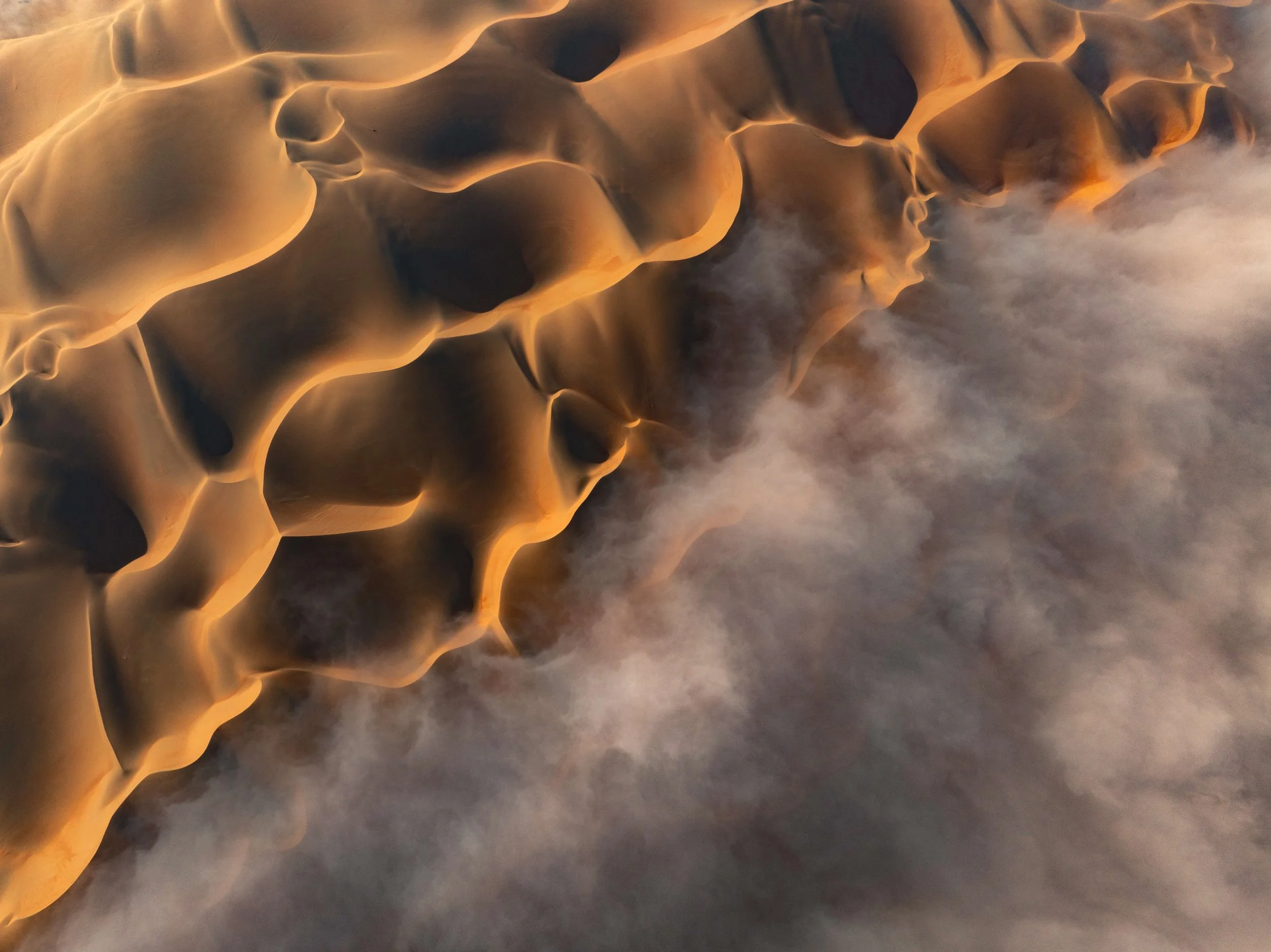 aerial-sand-dunes-meeting-fog-uae-desert-sarab.jpg