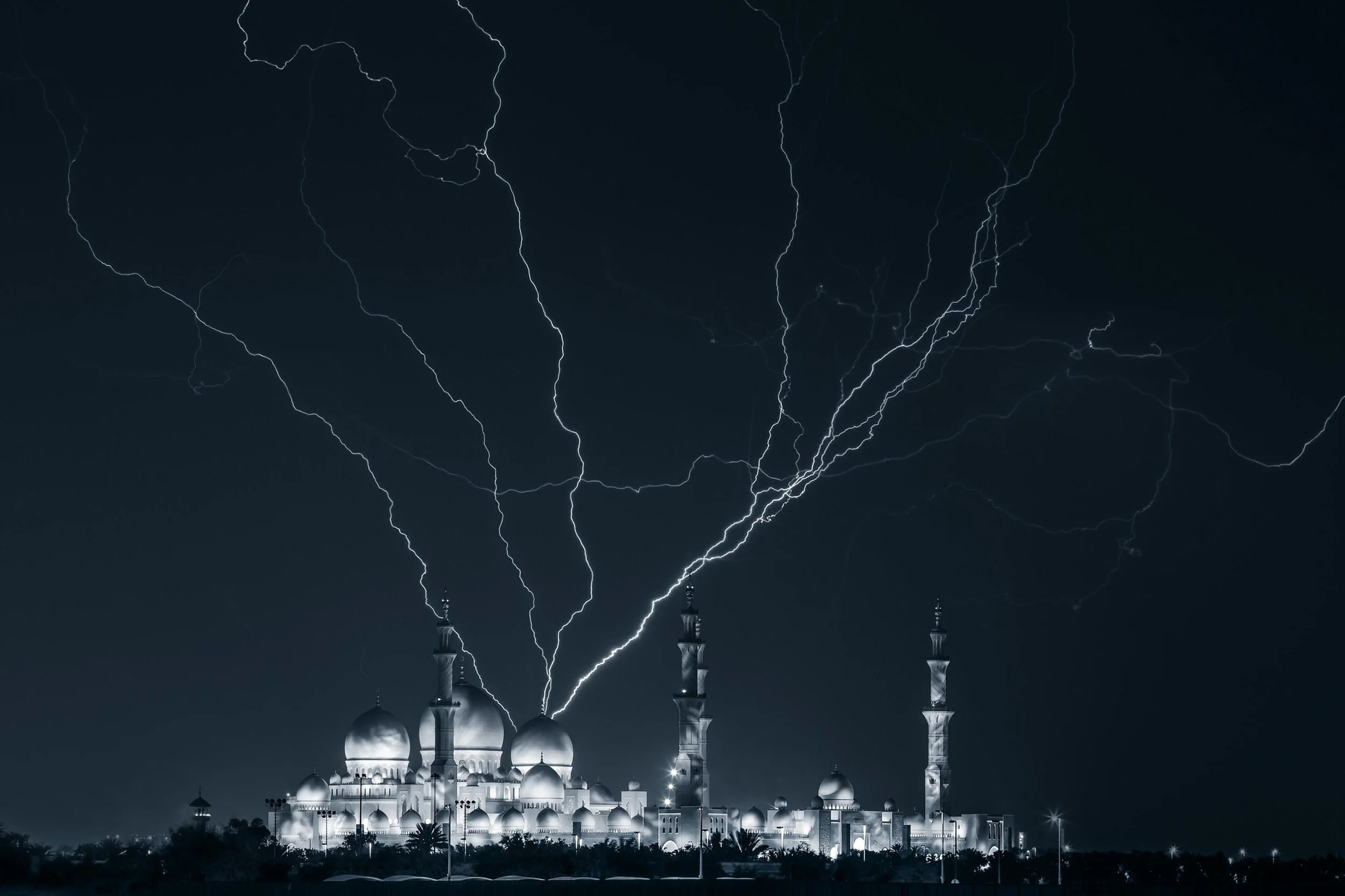 Lightning strikes above Sheikh Zayed grand mosque in Abu Dhabi at night - photograph by Khalid Alhammadi, SARAB Art Production