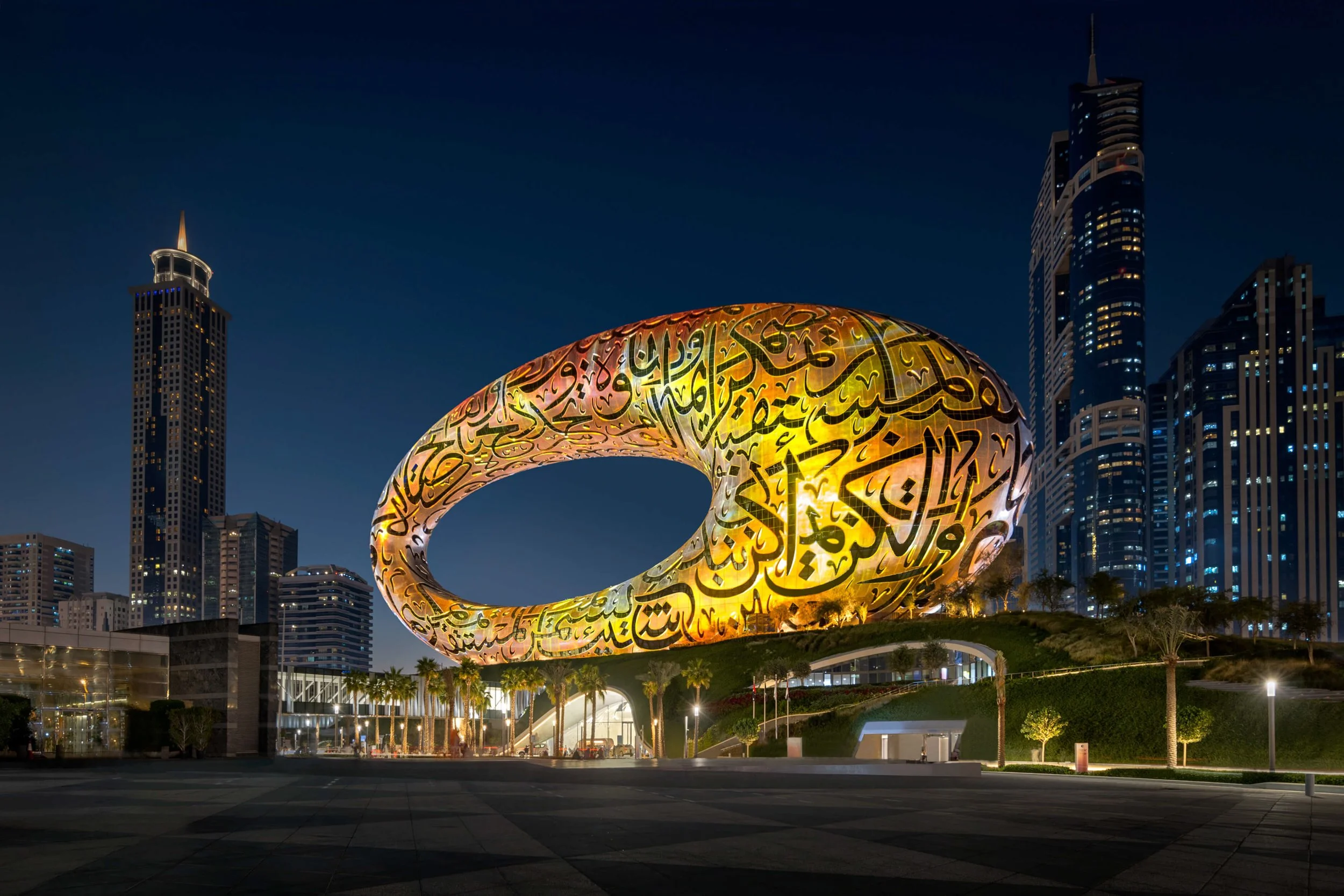 Museum of the Future illuminated in Yellow at night with Dubai sheikh zayed road skyline — fine art landscape photograph by Ahmad Alnaji, SARAB Art Production