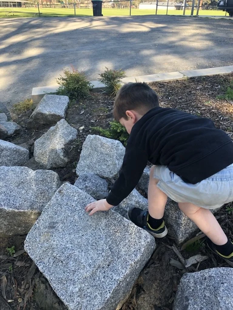 tait on rocks.jpg
