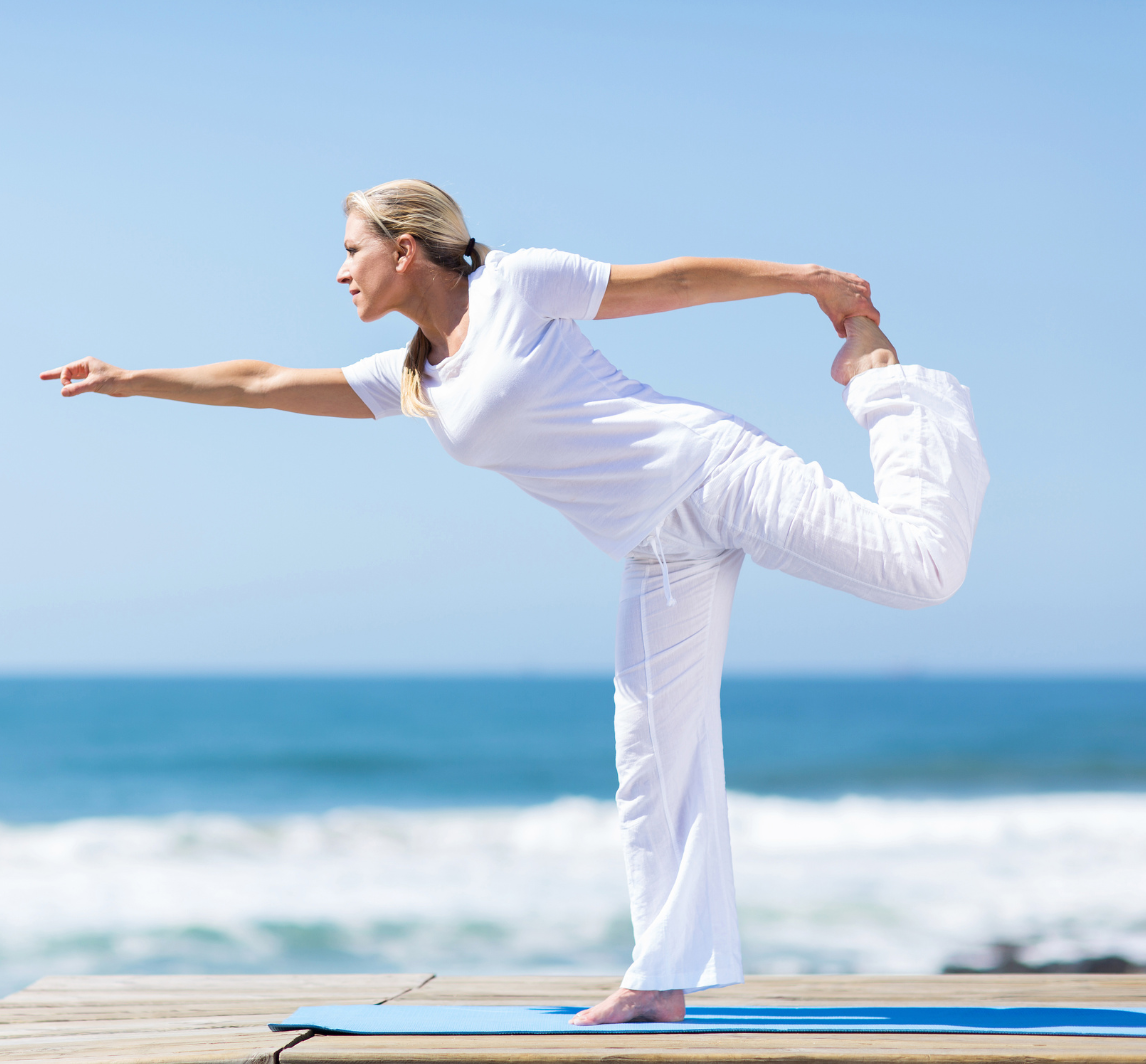 woman-yoga-by-ocean-crop.png