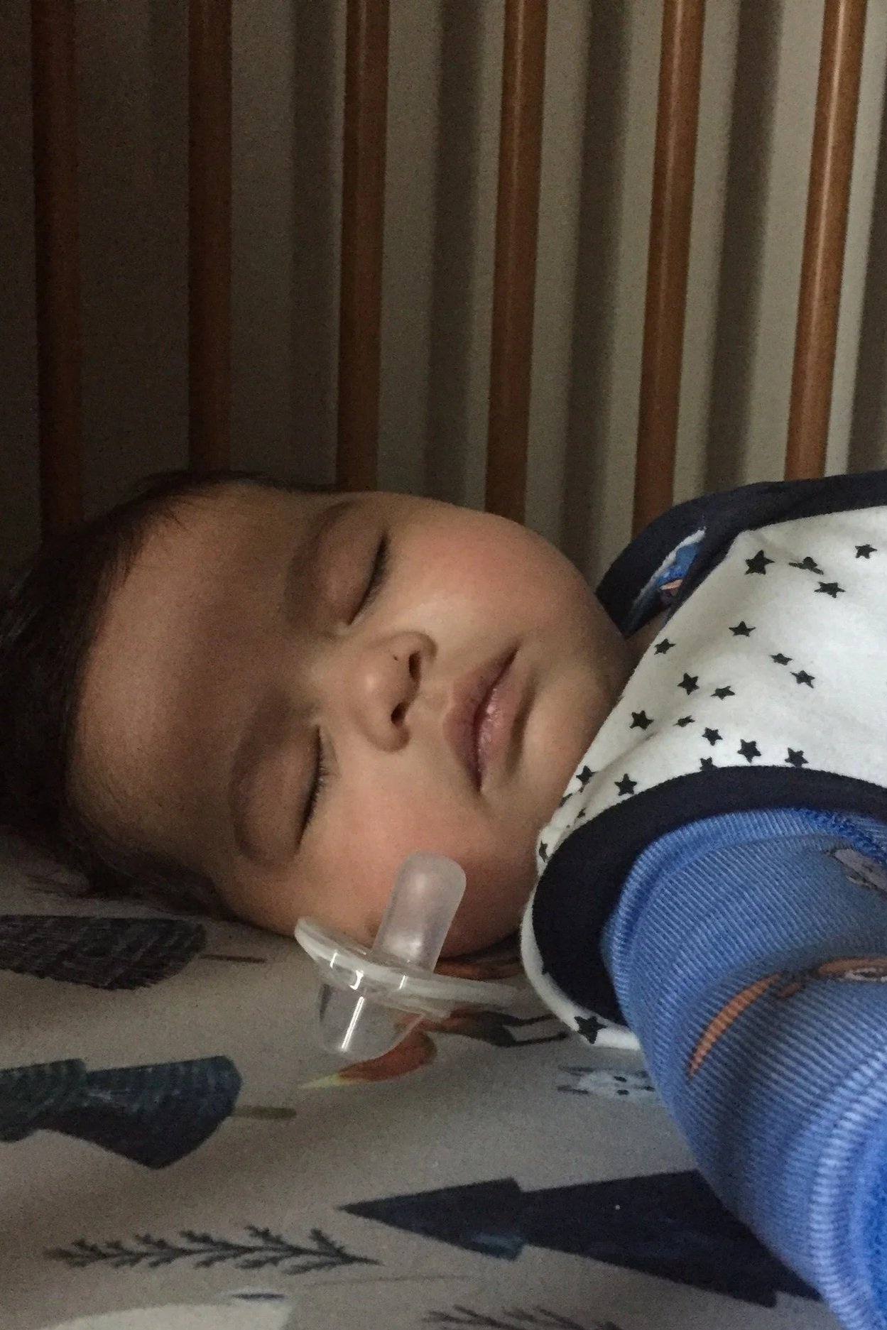 Sleeping baby with care postpartum doula