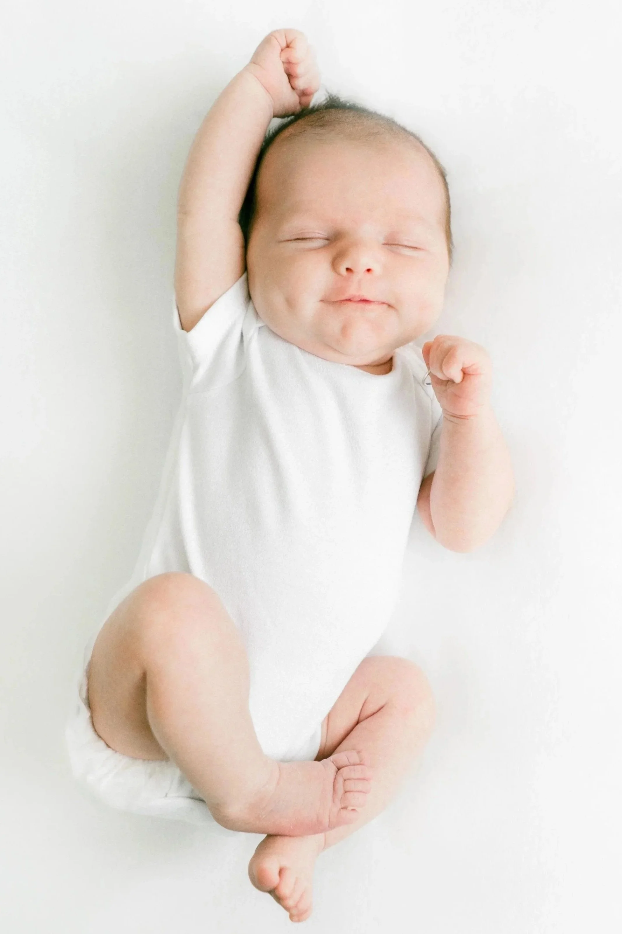 A content, sleeping, newborn baby.  A postpartum doula helped calm and soothe.