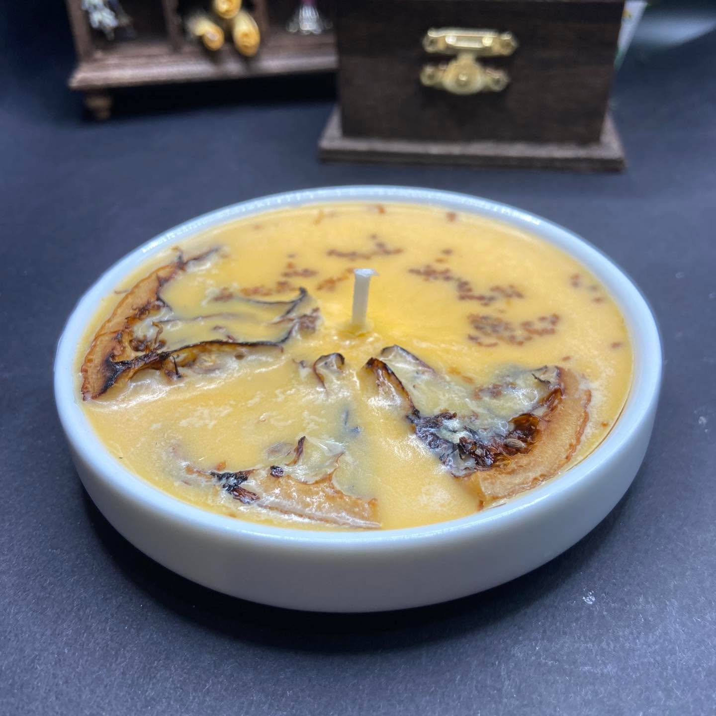 This orange and vanilla scented candle was made with thoughts of orange creamsicles and positive vibes ✨

Decorated with dried oranges and orange zest, this pale orange colored candle is sure to brighten your day ☀️

This candle is $15. It will not a