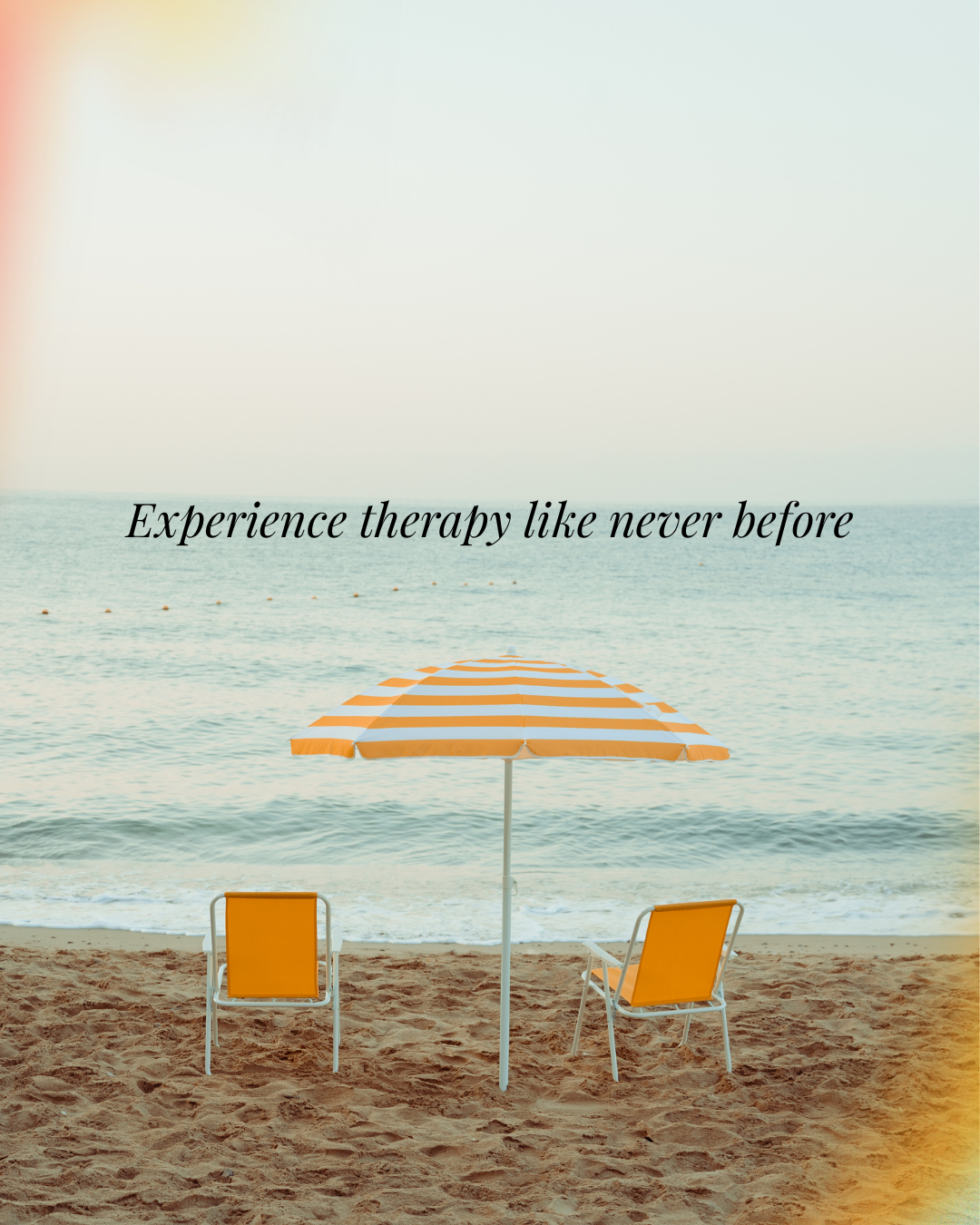 A beach scene with two yellow chairs and a yellow and white striped umbrella facing the ocean, with the phrase 'Experience therapy like never before' overlaid in black cursive text.