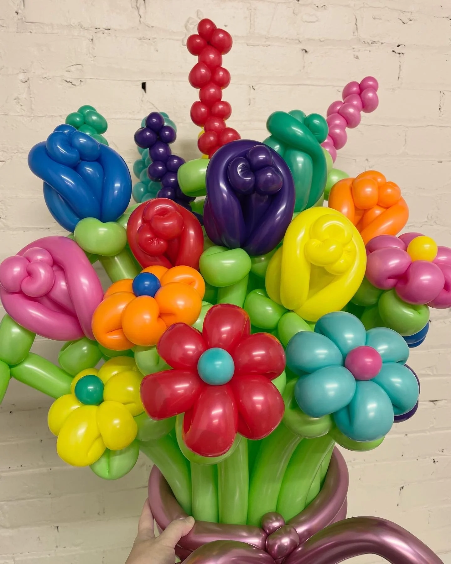 brightly colored twisted balloon flowers bundled in a bouquet