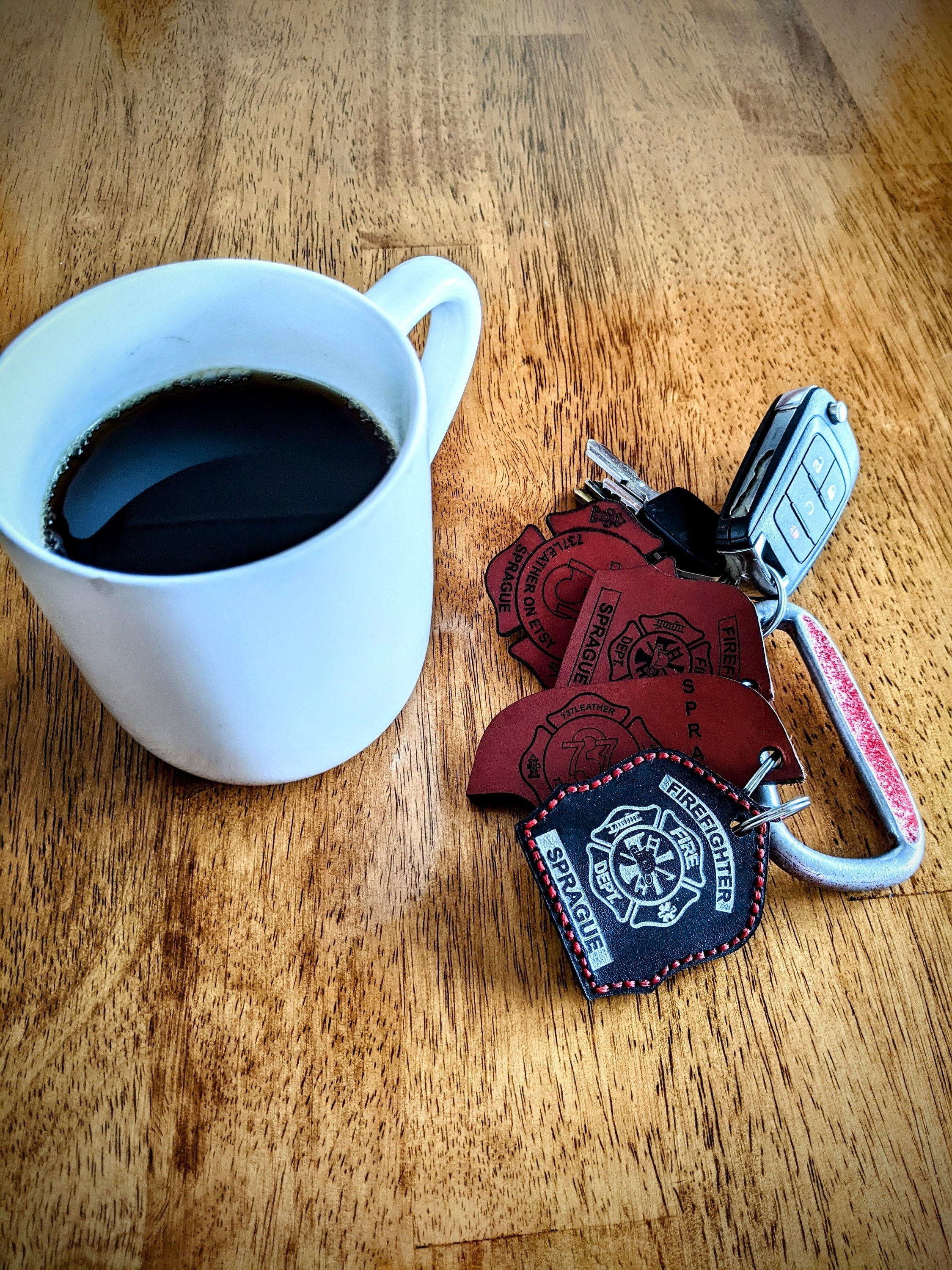 Custom Black Leather Firefighter helmet shield keychain.
