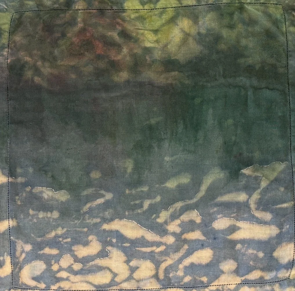 In weathered silence I think of you. 3
bleach, dye, acrylic, embroidery
on cloth napkins.
2025.
16 by 16 inches