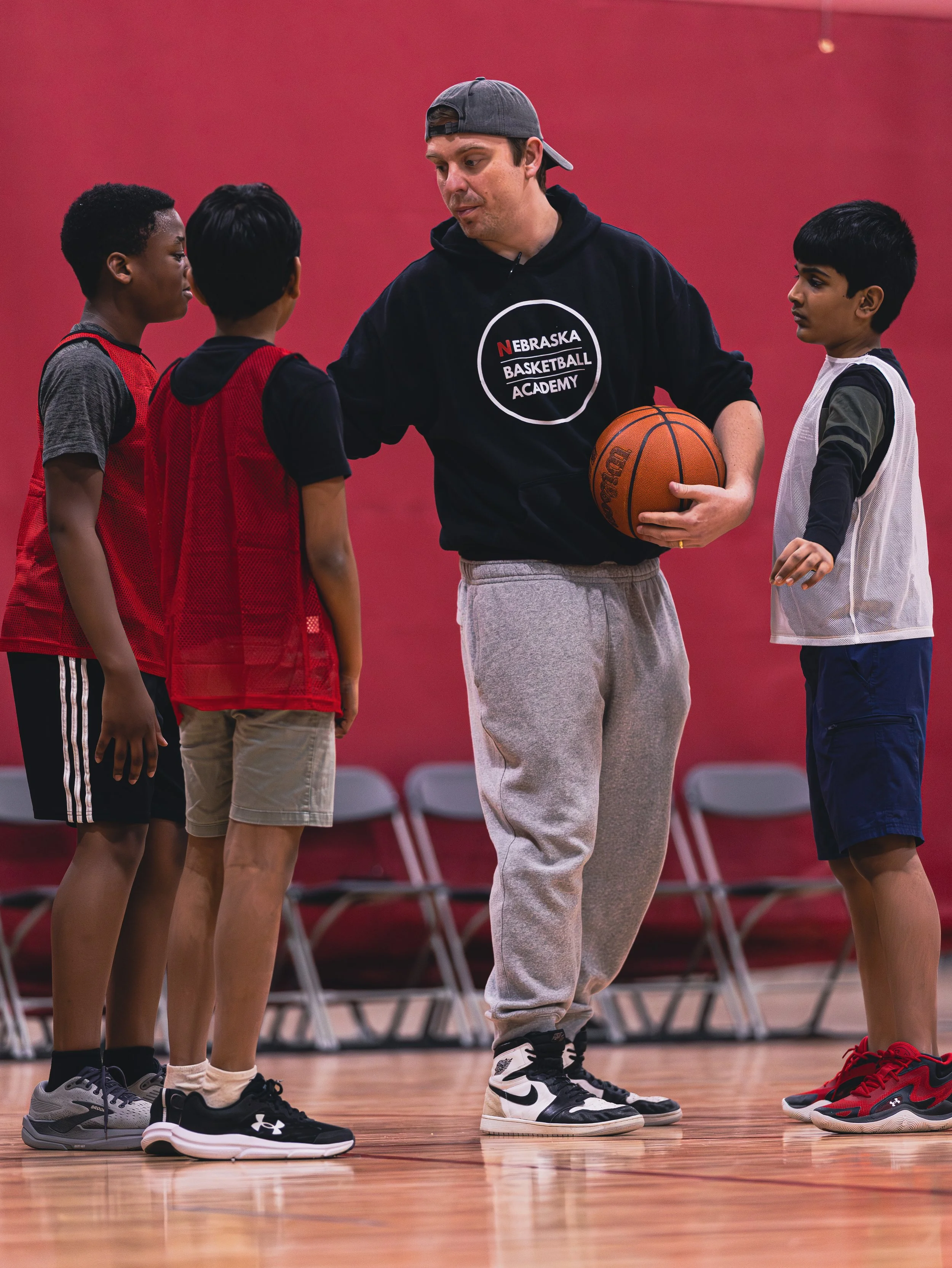 A young man in Nebraska Basketball Academy hoodie