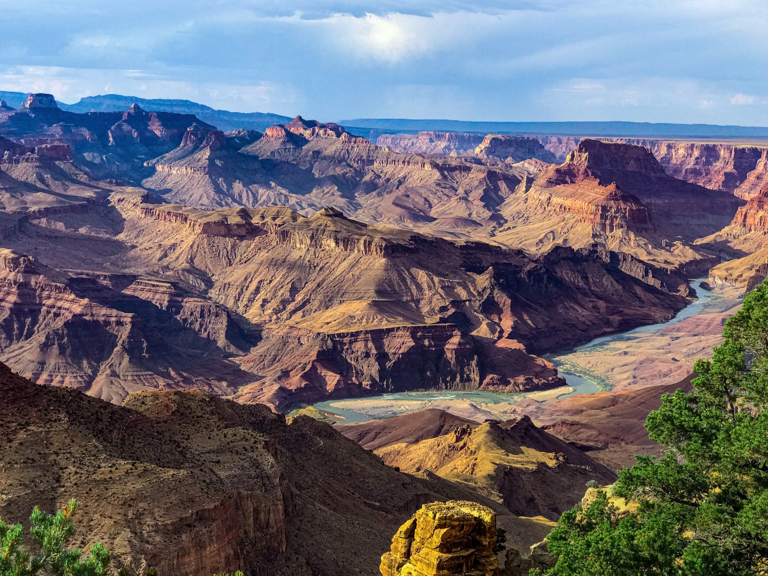 River winding between deeply layered canyon walls
