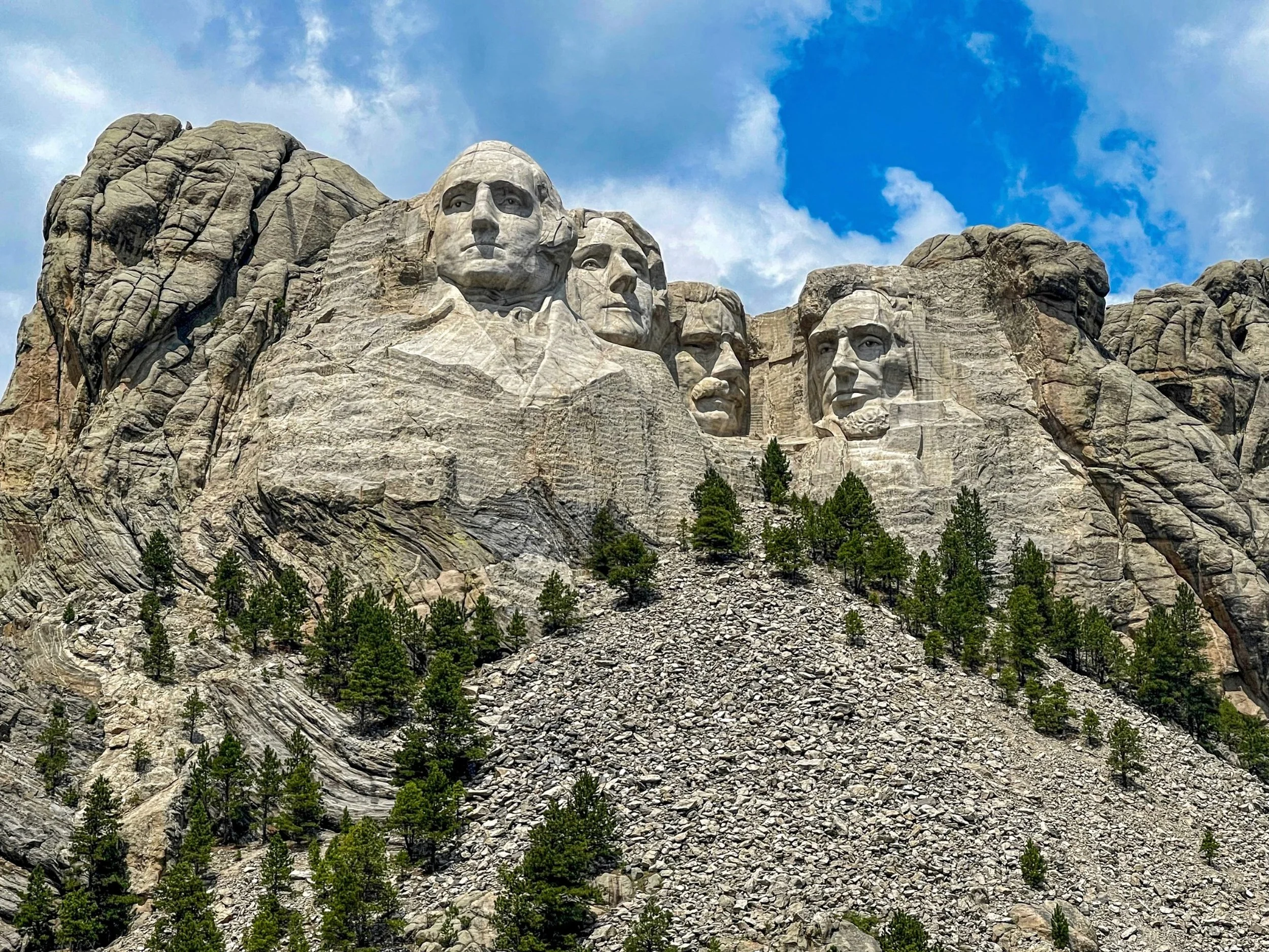 Close view of the four carved presidential faces at Mount Rushmore