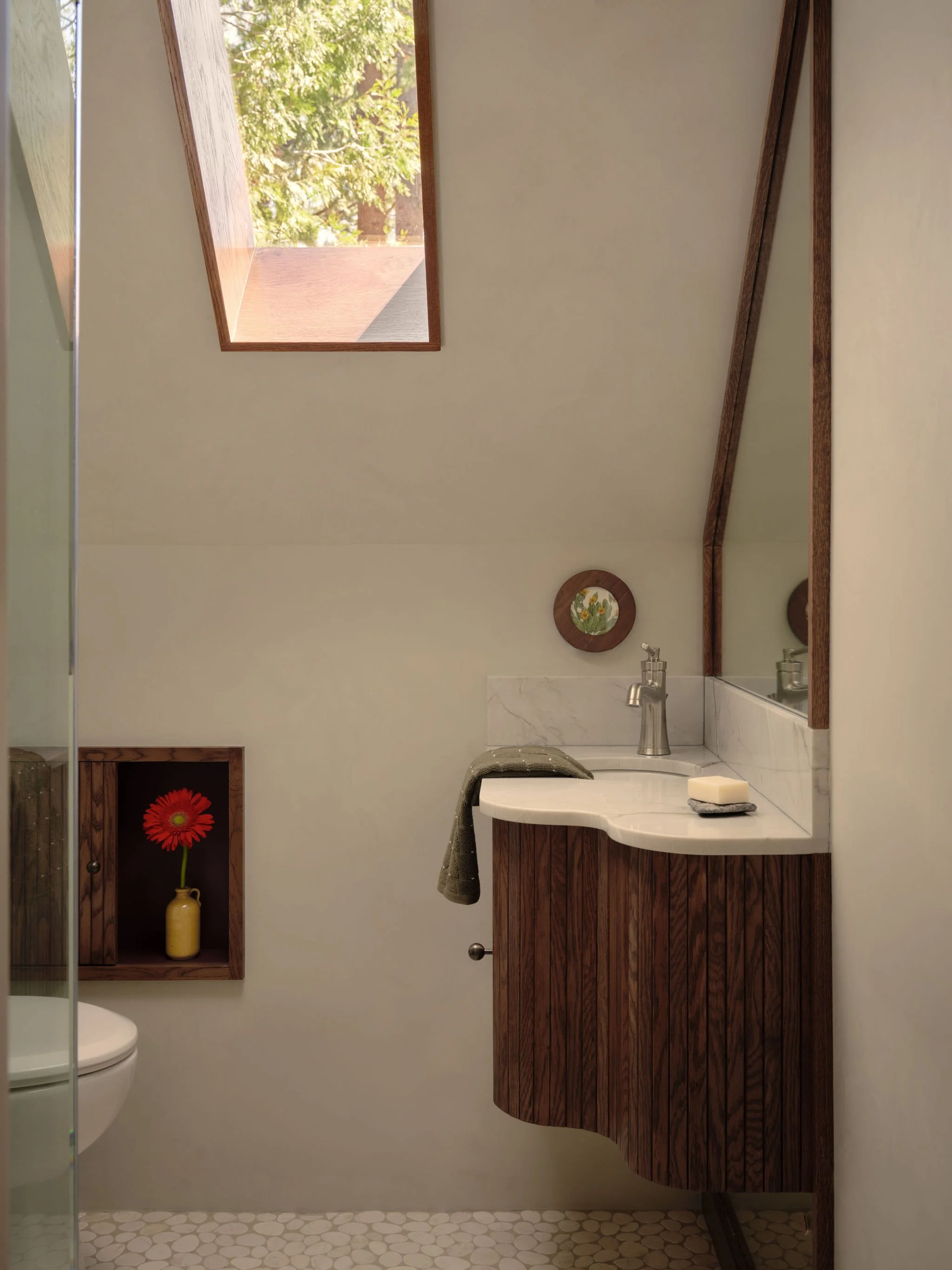 Small Tahoe Bathroom Curved Vanity Skylight Dark Wood Plaster Modern by Andrea Lackie Design