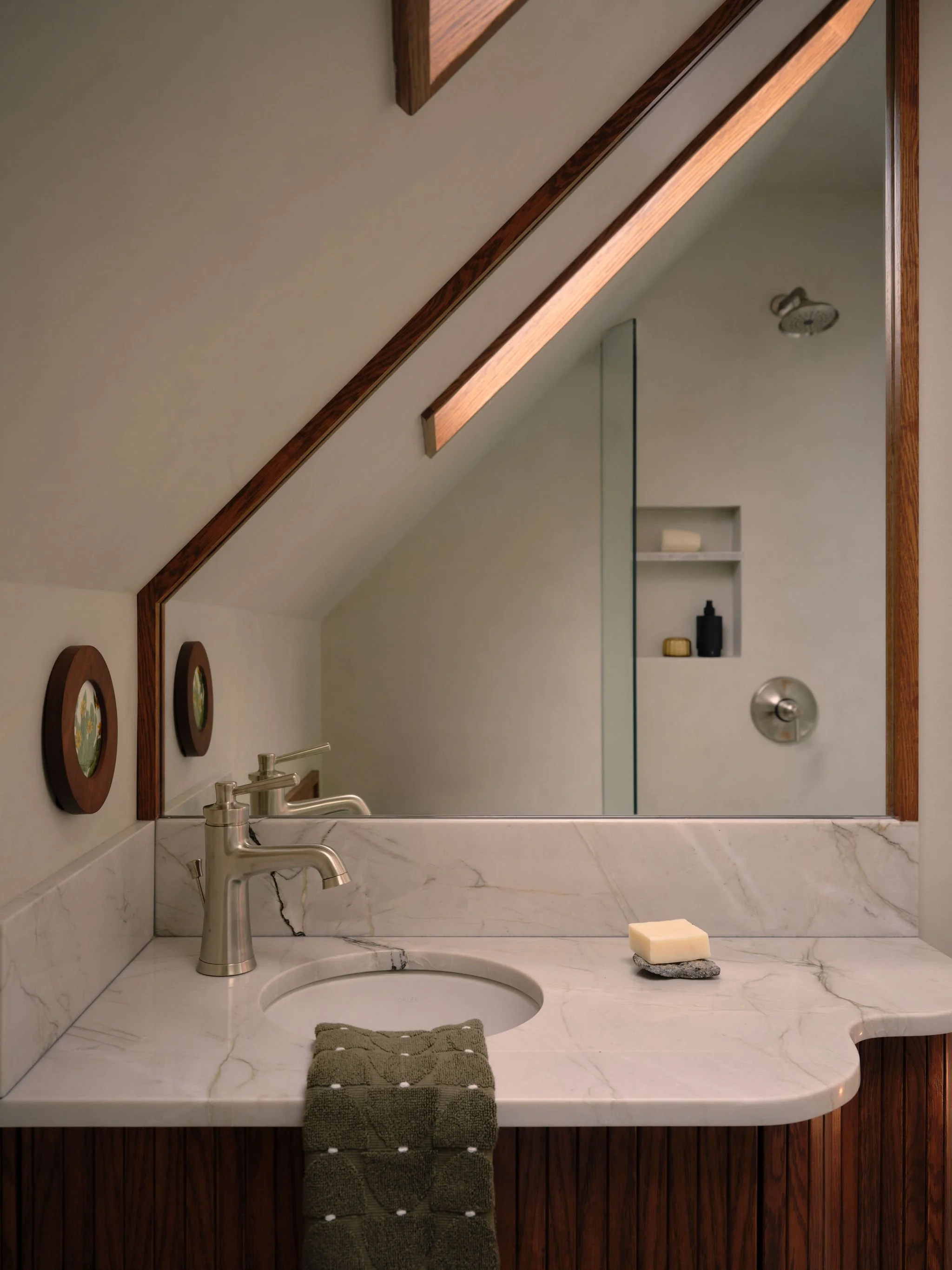 Small Tahoe Bathroom Curved Vanity Skylight Dark Wood Plaster Modern by Andrea Lackie Design