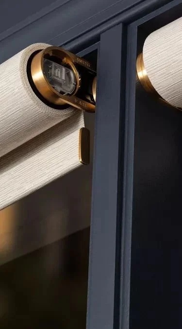 Close up of motorized roller shades from Lutron Luxury.