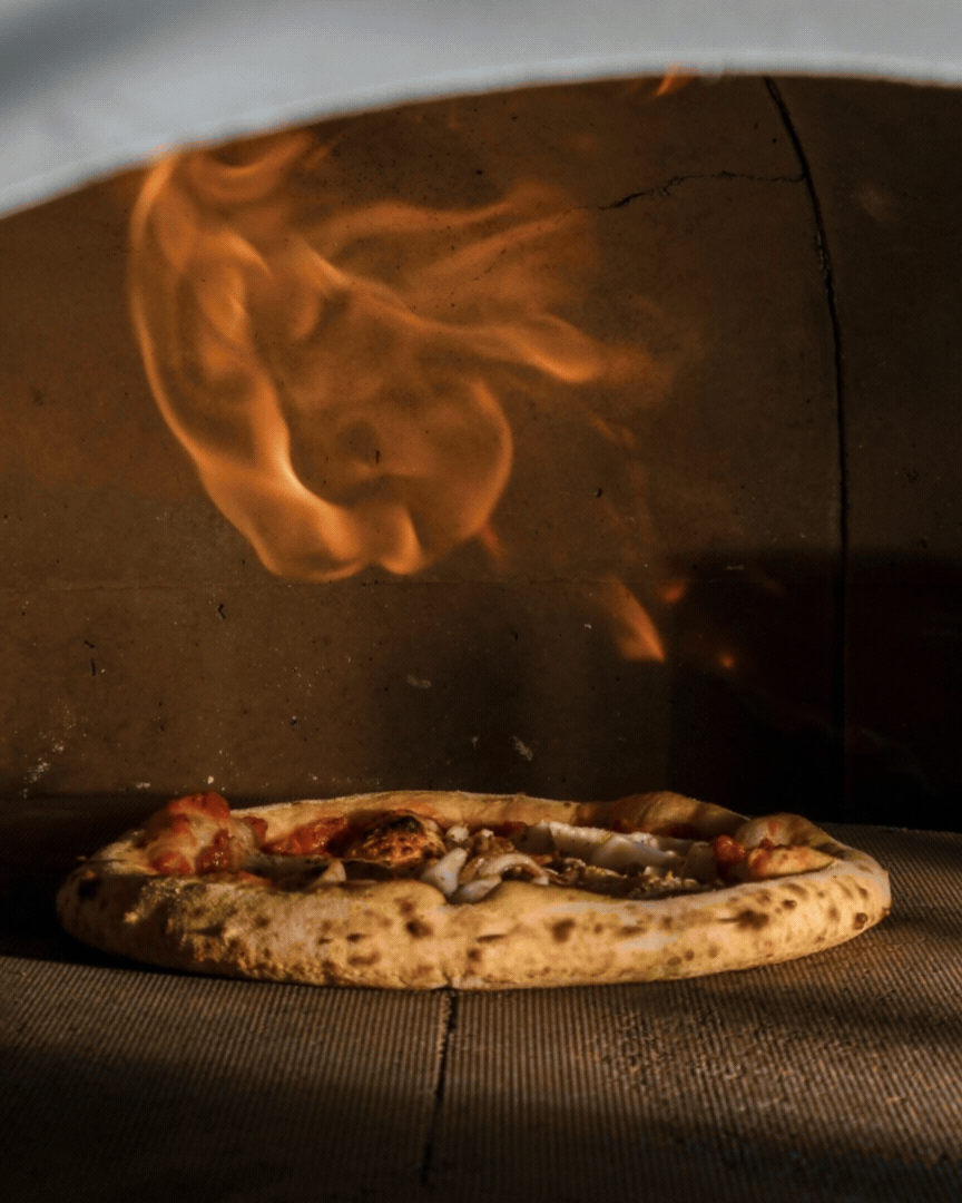 Guests at Bobbi’s Adelaide enjoying 90 minutes of all-you-can-eat woodfired pizza in a lively, social atmosphere