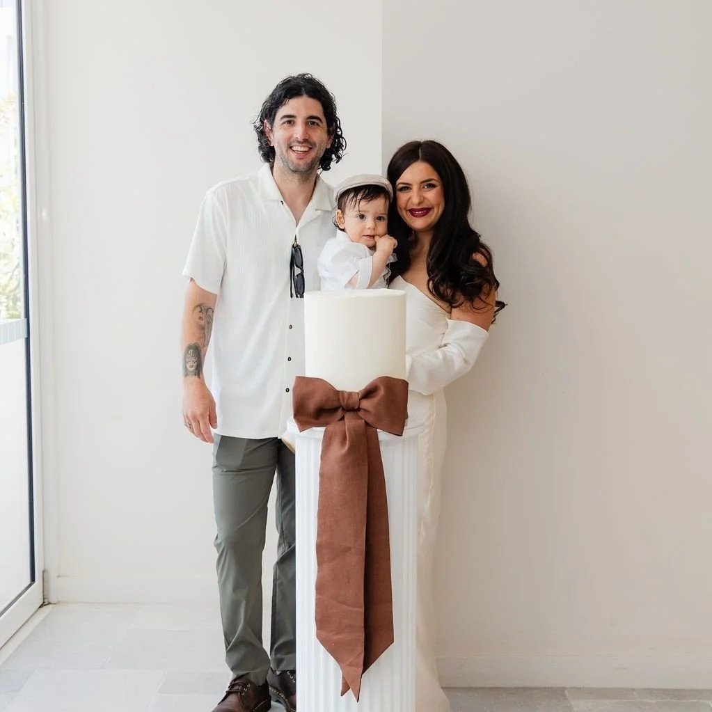 A photo of a family at a baby shower celebrating their baby