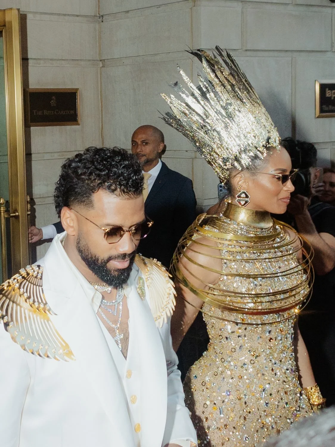 Russell Wilson and Ciara preview their Met Gala looks outside the Ritz-Carlton in NYC.