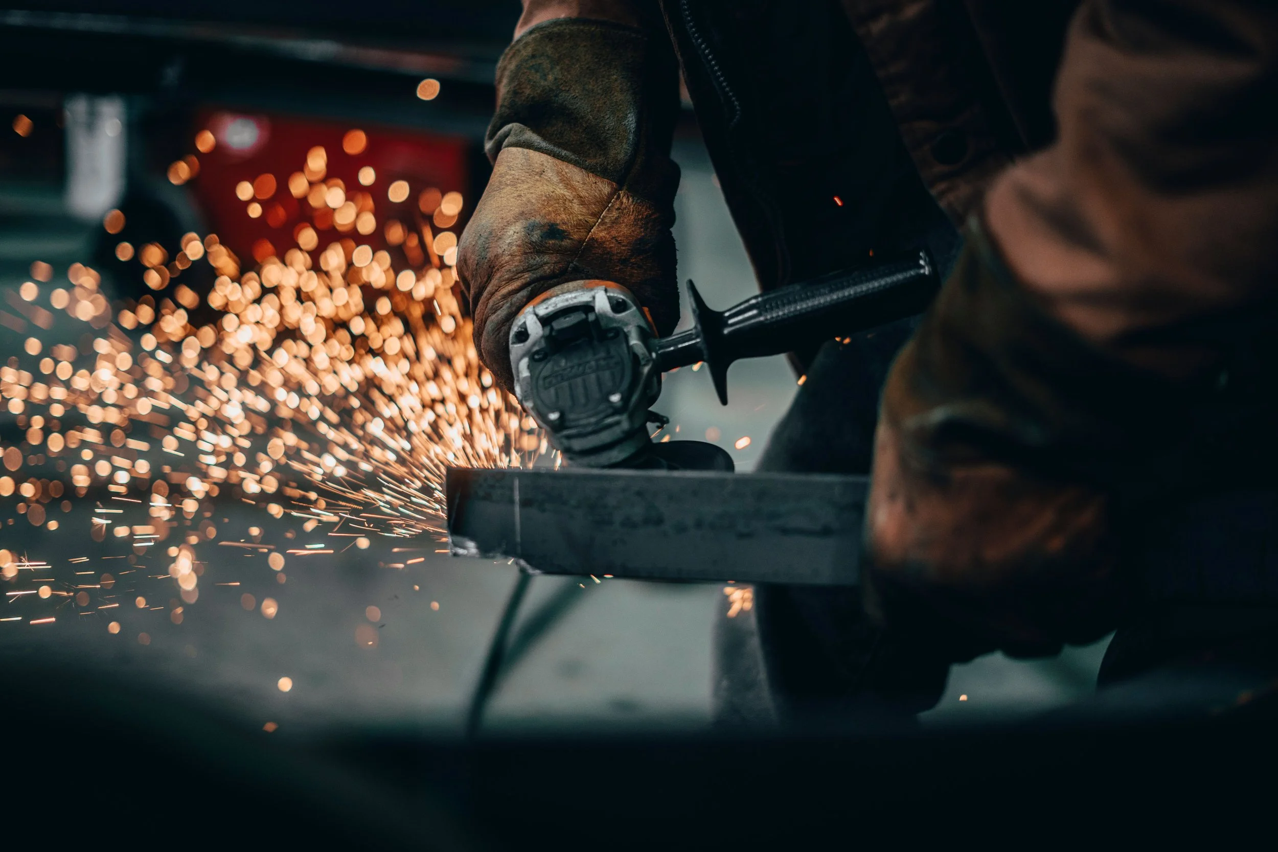 What is mill scale and why should it be removed prior to welding or painting?