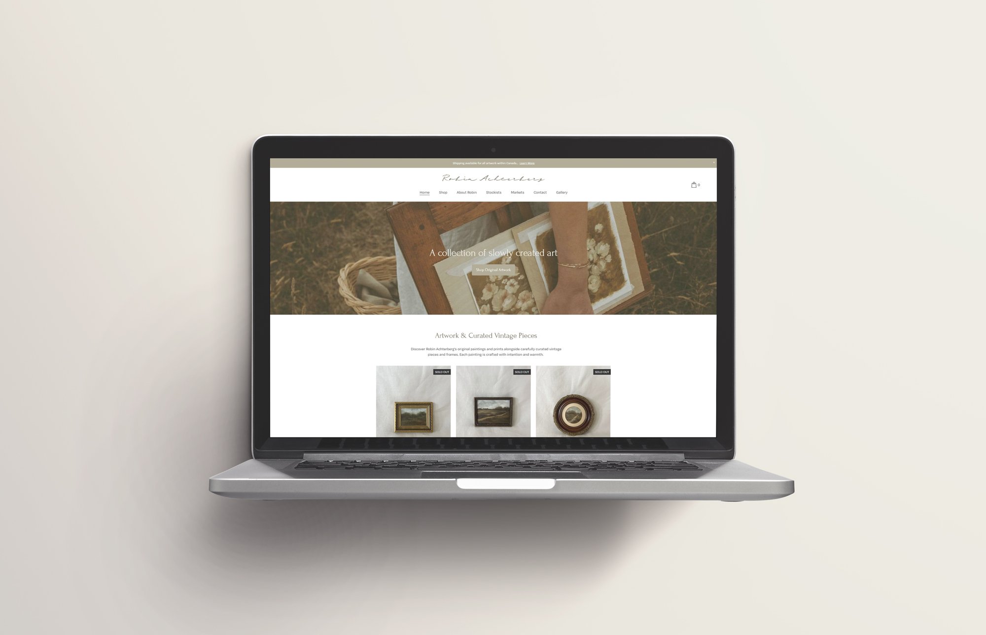 A laptop displaying an art website for Robin Achterberg with vintage artwork and curated pieces.