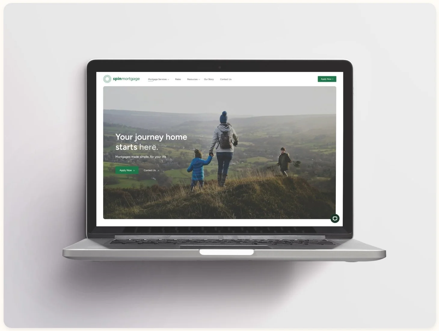 An image of a laptop displaying the Spin Mortgage website homepage