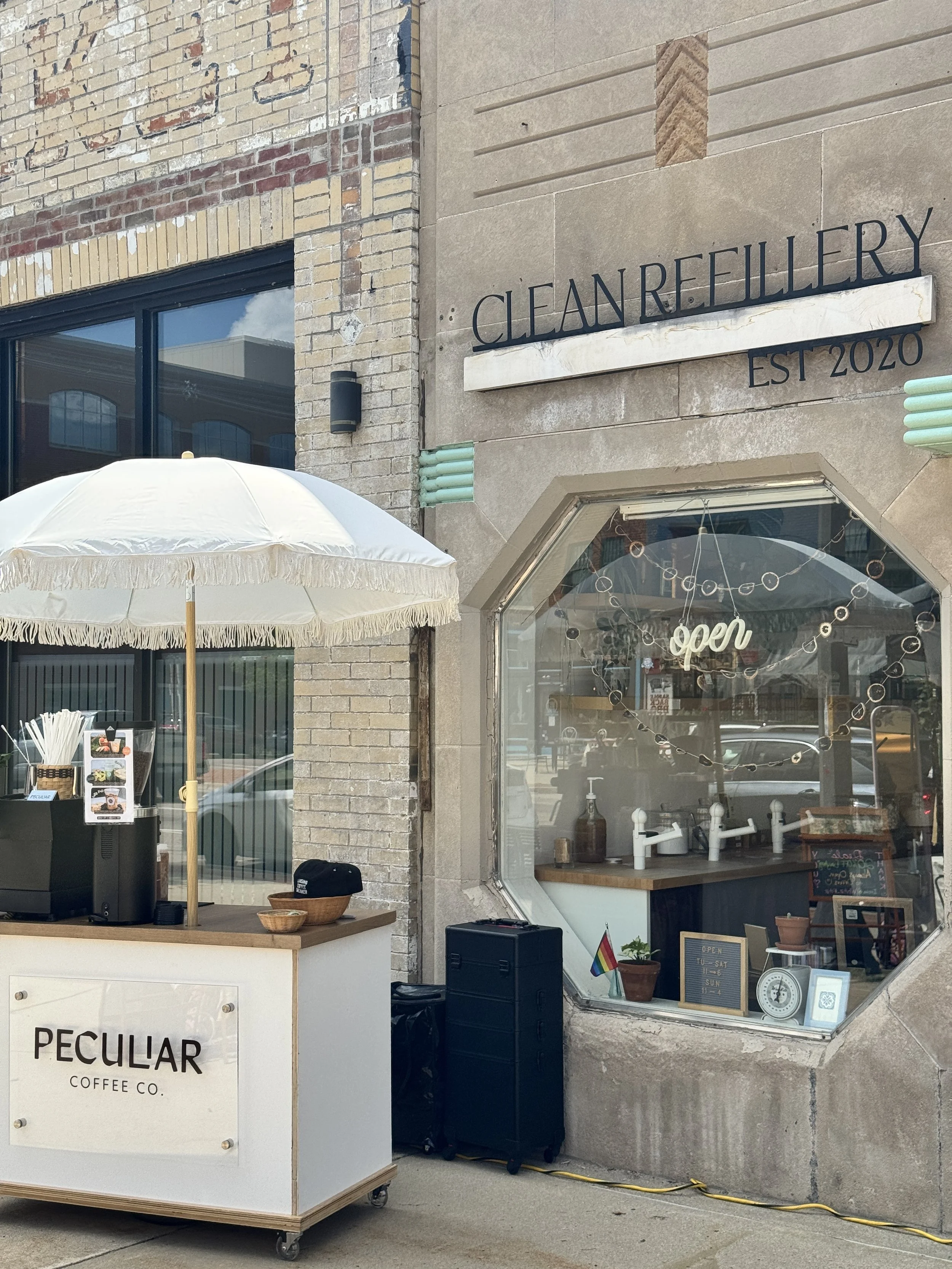 A coffee cart pop up in front of a local Lansing shop