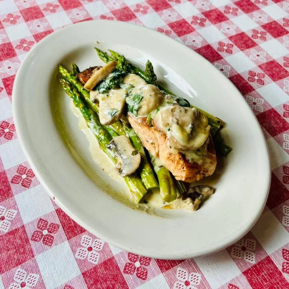 We&rsquo;re not great at remembering to post our specials&hellip; so when we do, you know it&rsquo;s a good one. 😋

Today&rsquo;s feature: salmon on a bed of asparagus, topped with a rich Parmesan cream sauce, saut&eacute;ed mushrooms, and spinach.

