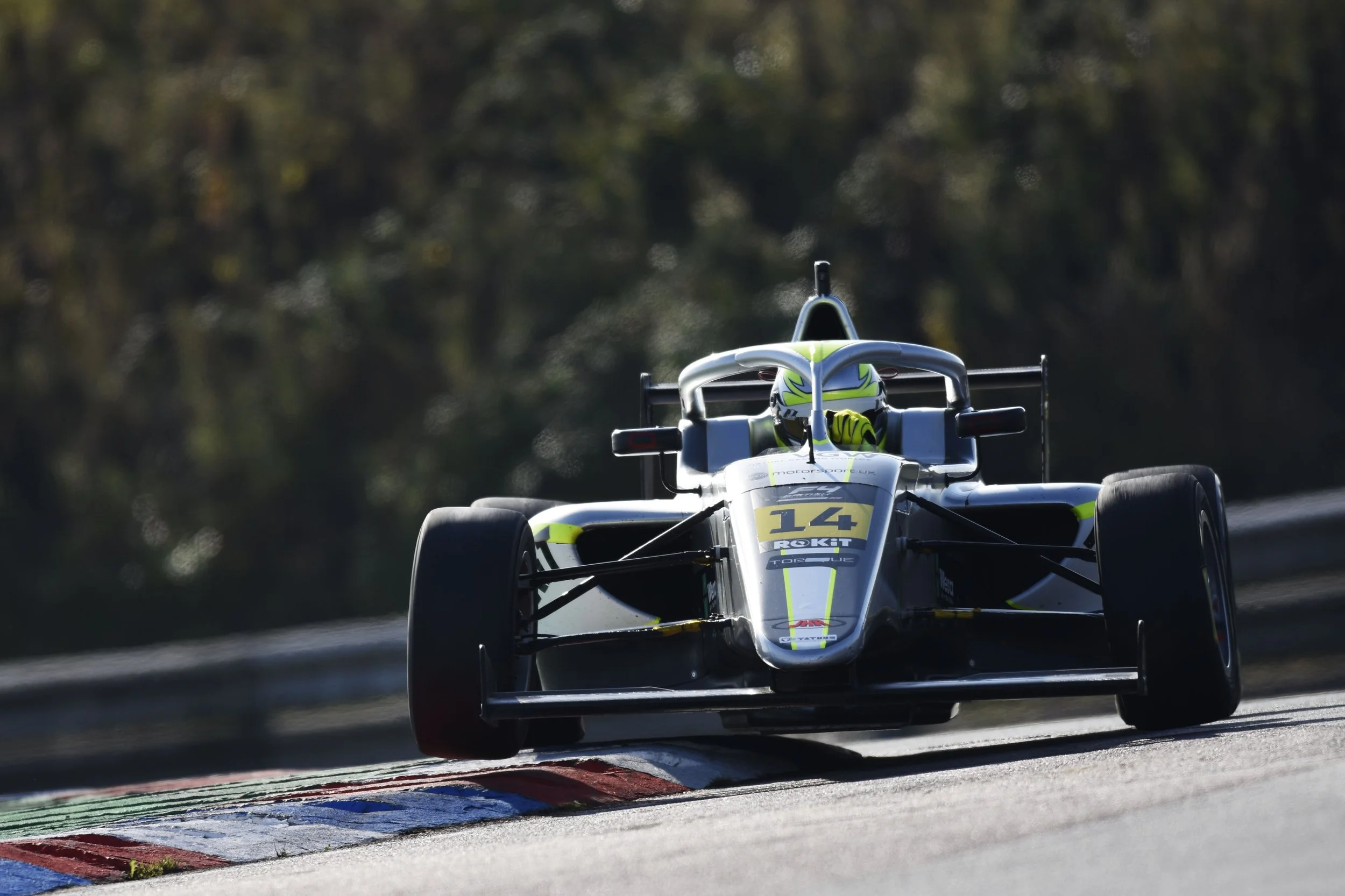 Over the curbs at Thruxton in F4 British Championship.