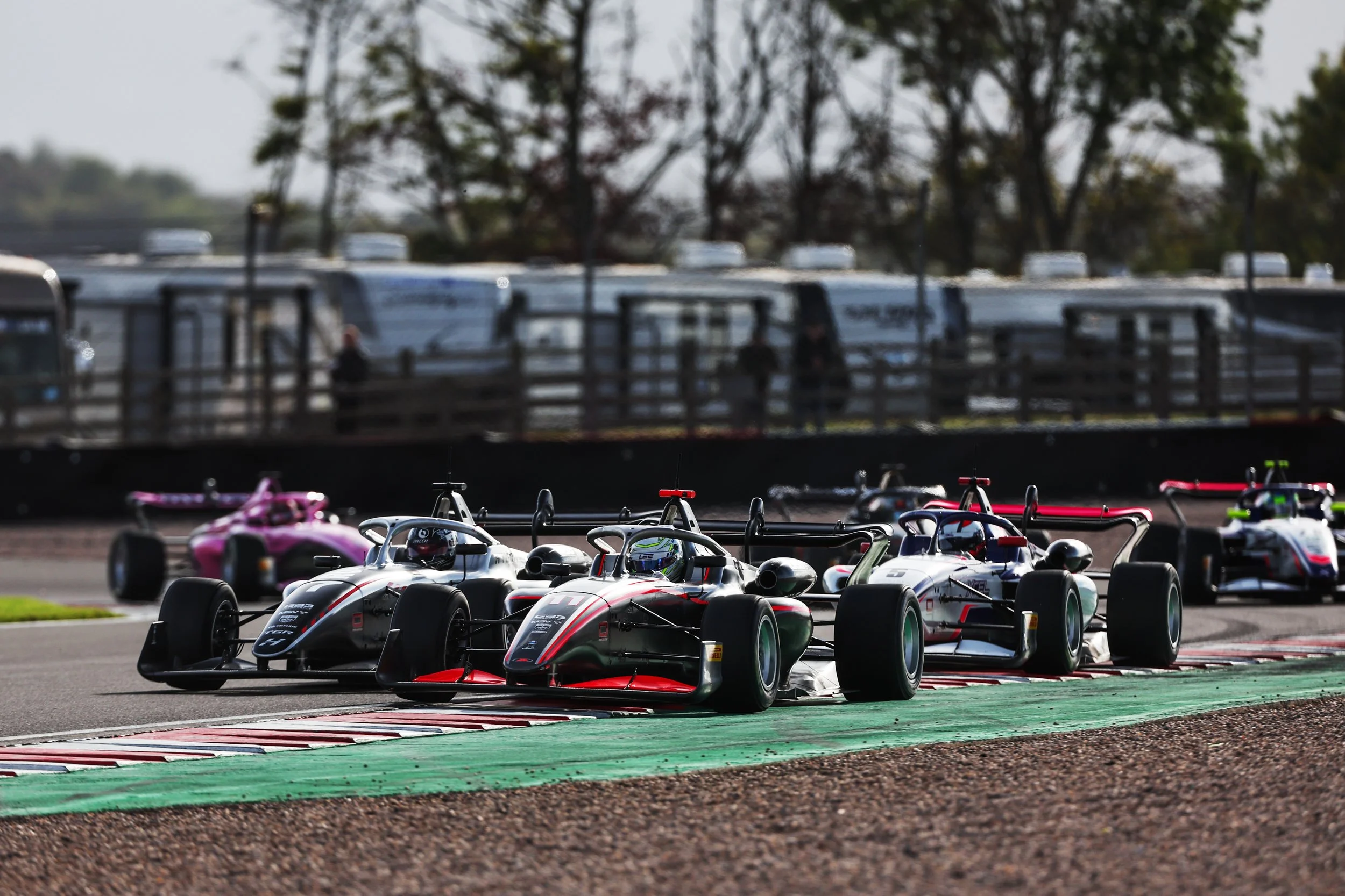 Overtaking around the outside in GB3 Championship.