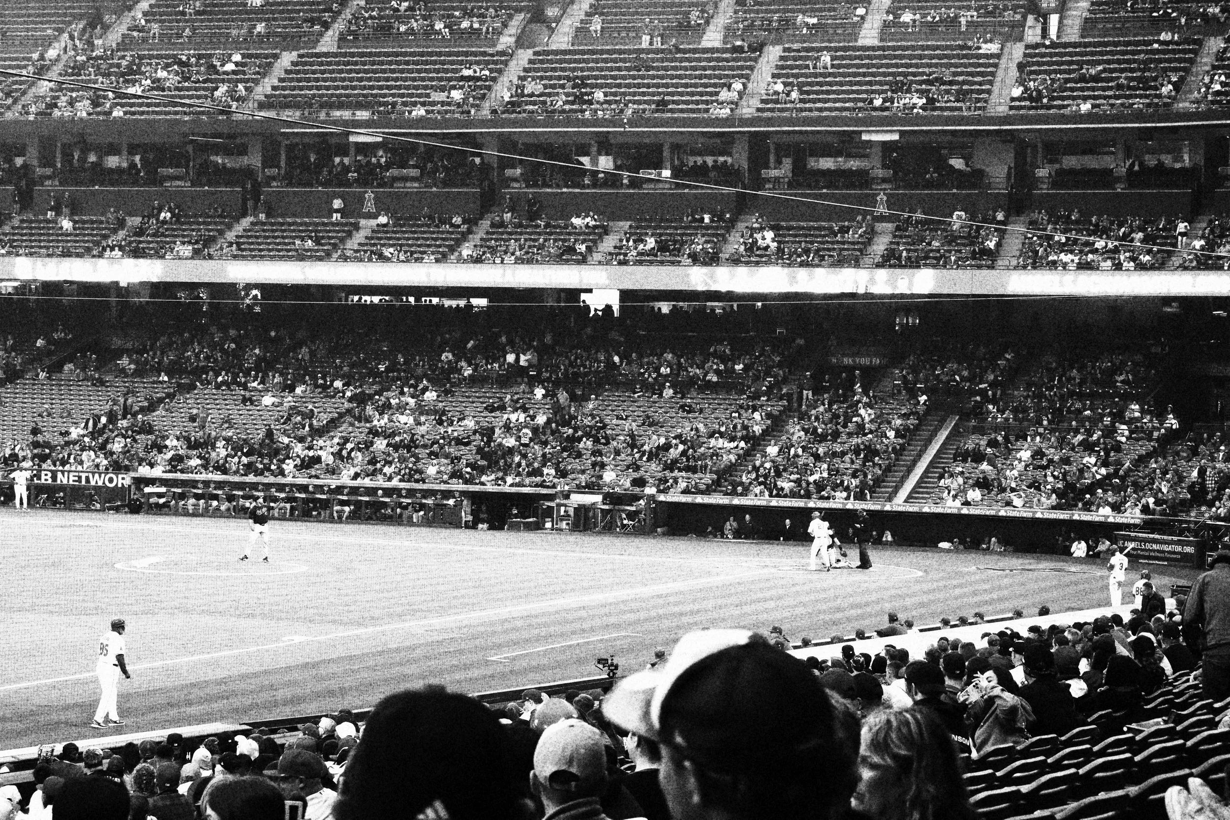 Black and white photo of fans and players at Angels stadium