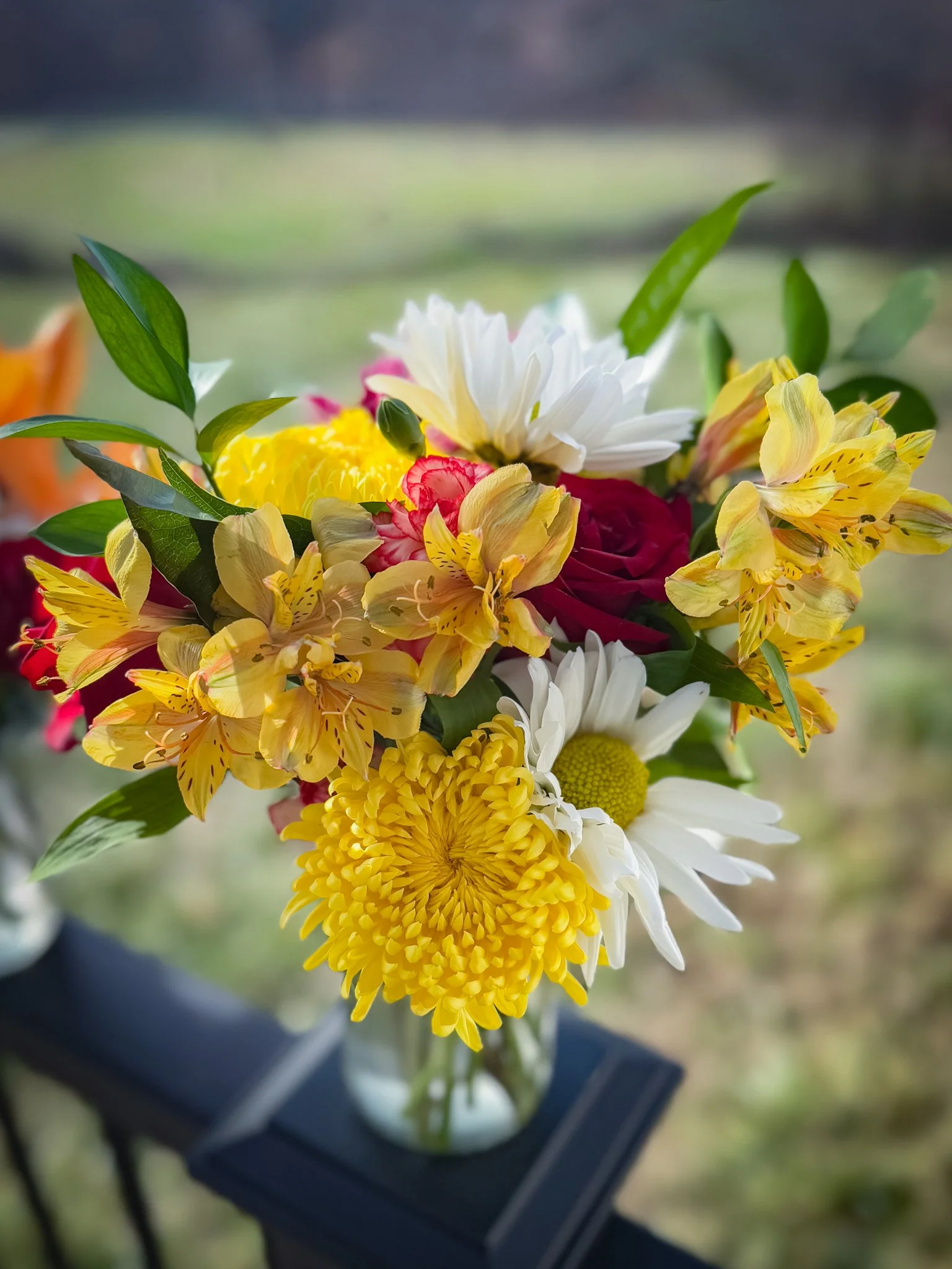 Designer's Choice Arrangement with two roses yellow mums alstroemeria greenery in a vase Valentine's Day Springfield MO