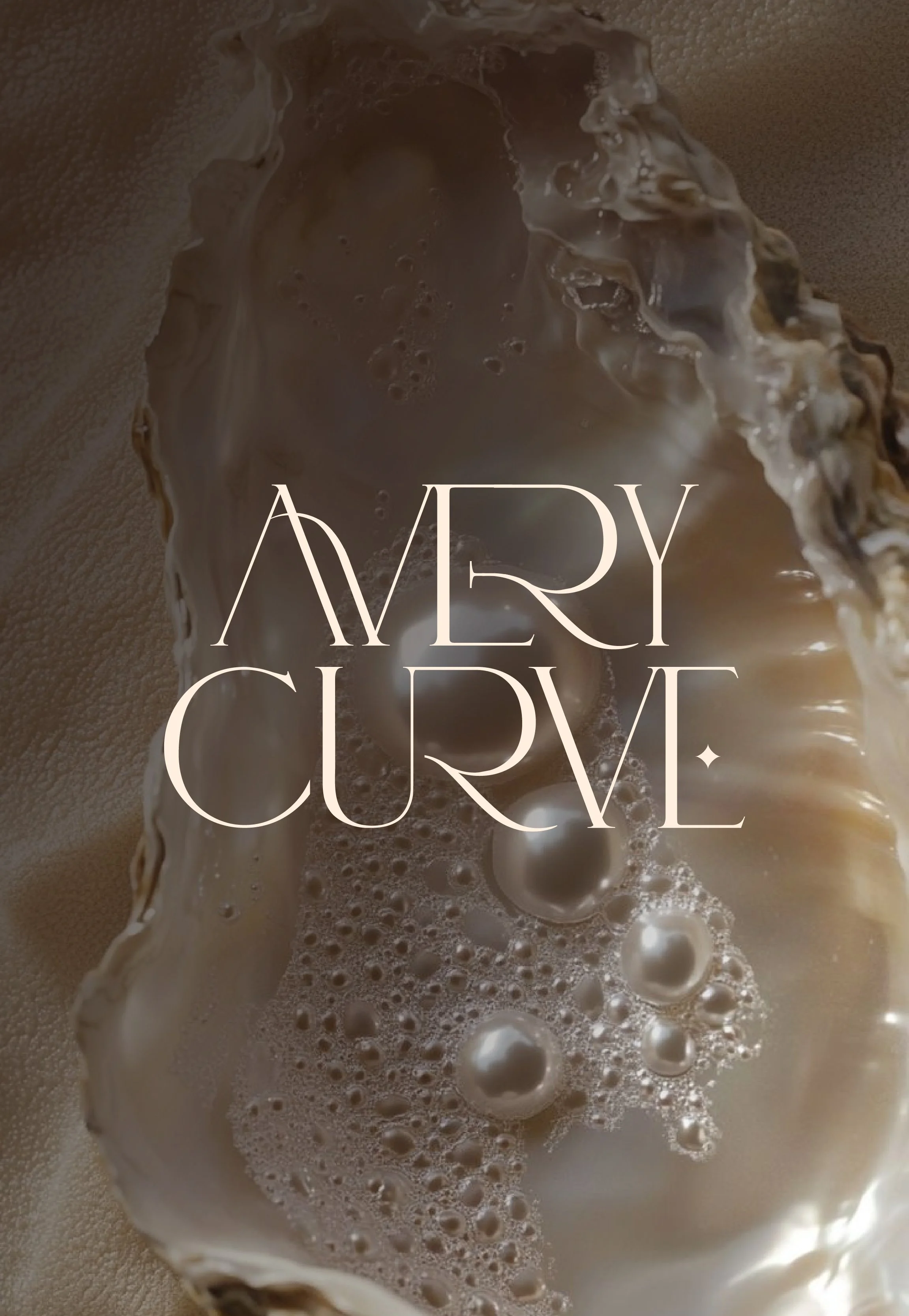 Close-up of a shell with foamy soap or bubbles inside, with the words "Merry Curve" overlaid in elegant, thin font.