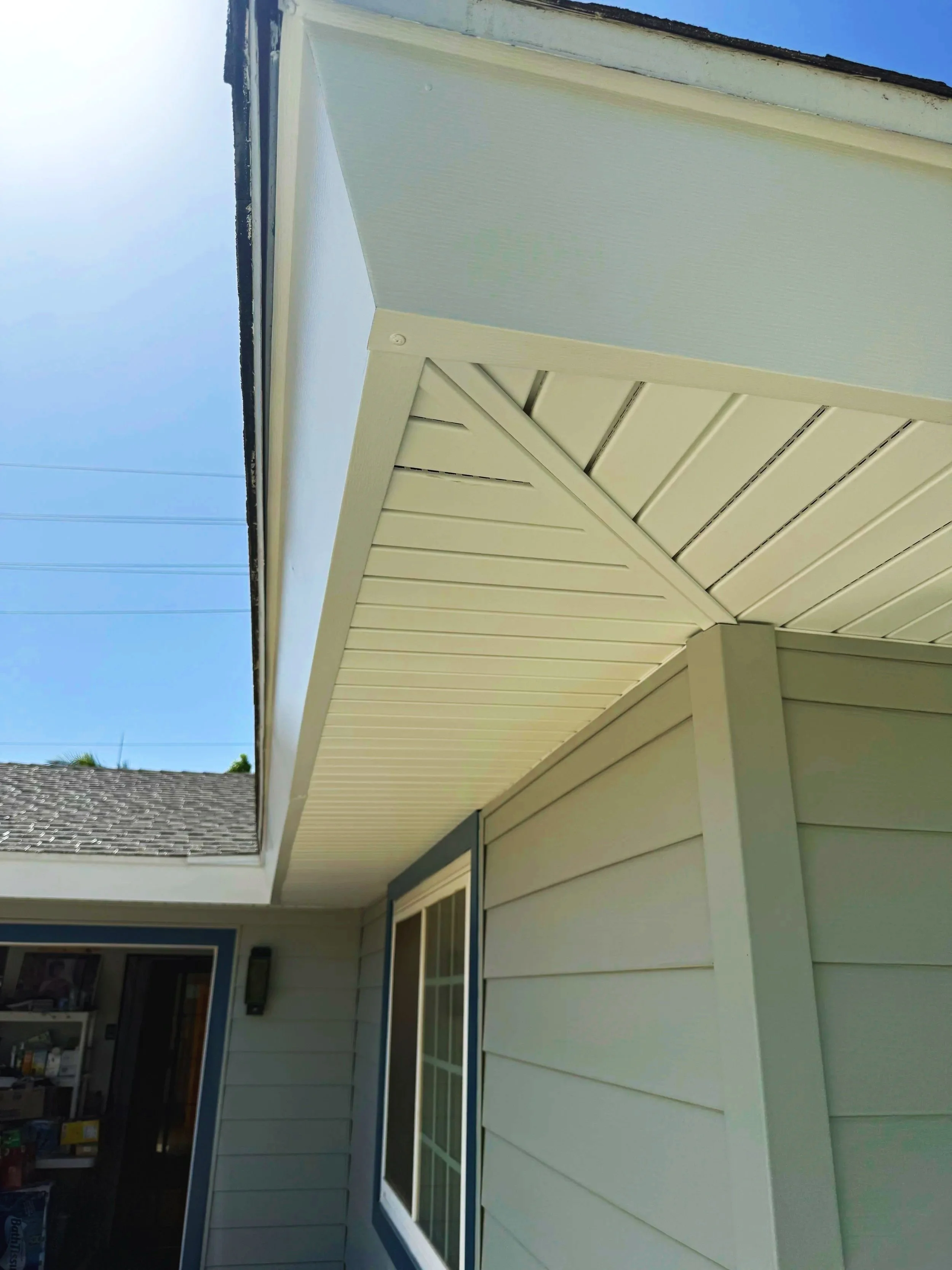 White vinyl soffit have been installed to cover the eaves of the home. The fascia board has also been wrapped with a white aluminum wrap to give it a great finished look.