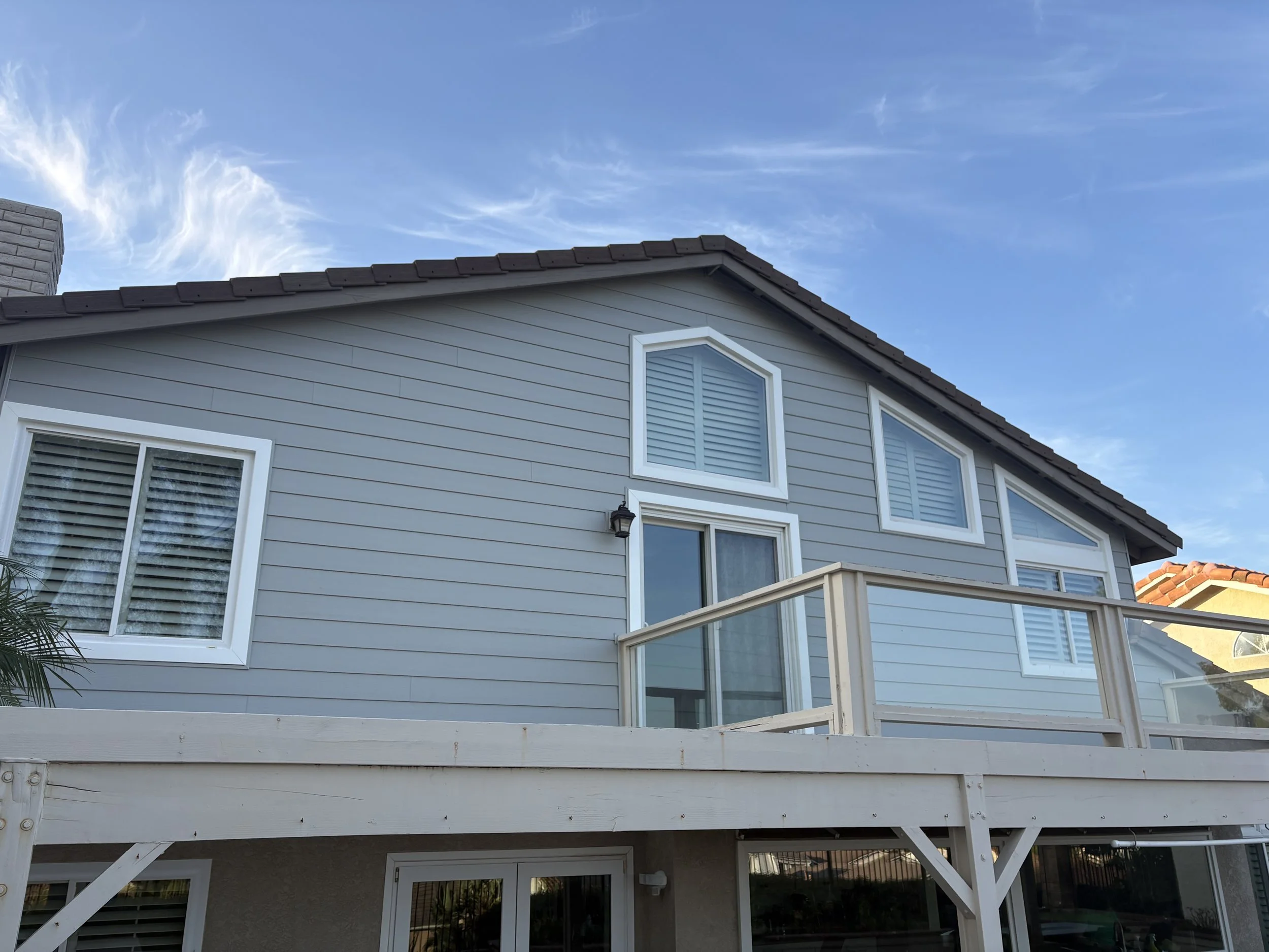 	
House with Ascend Composite Cladding in Cape Cod Gray color installed on the home. This also includes trim around the windows.
