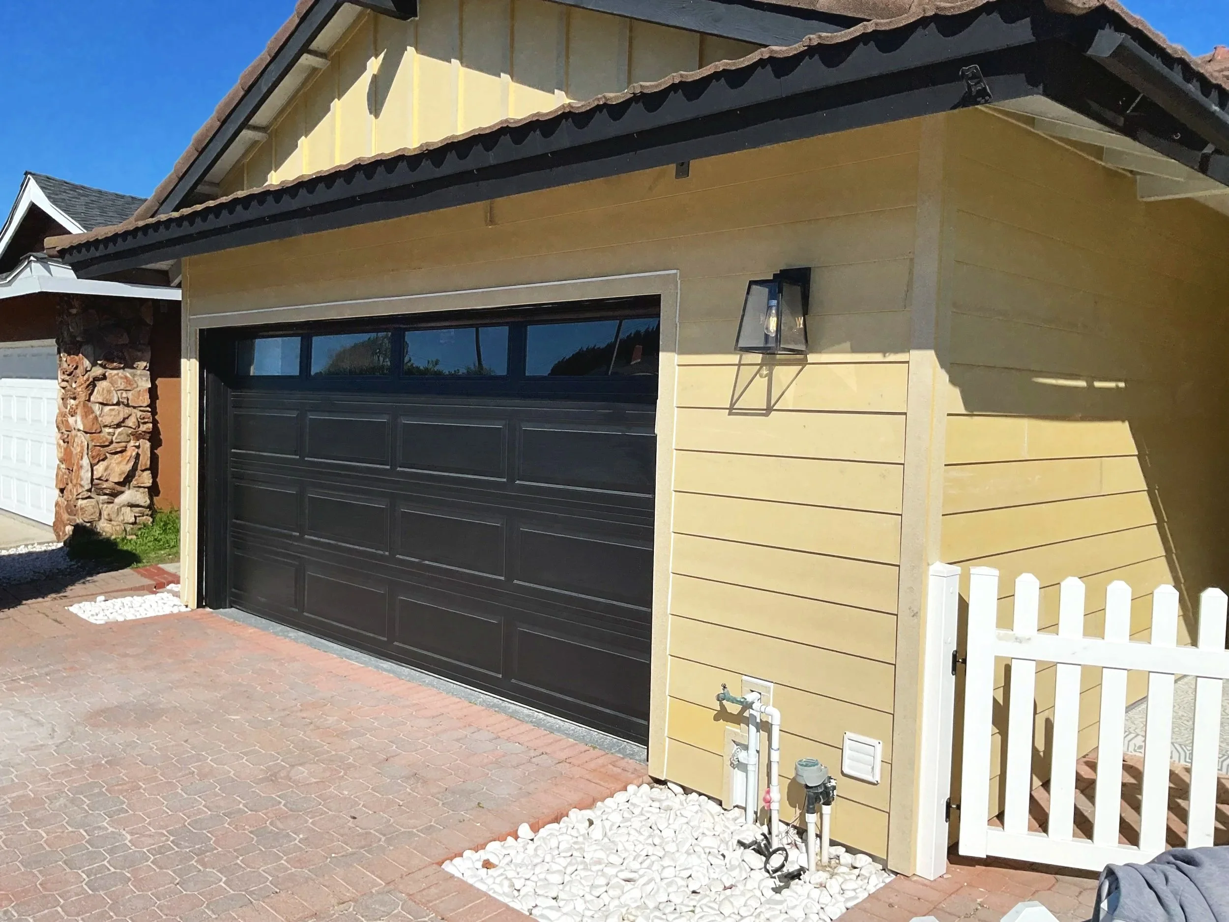 Horizontal James Hardie siding was installed on the walls of the home and Vertical Board & Batten James Hardie was installed on the upper gable area.
