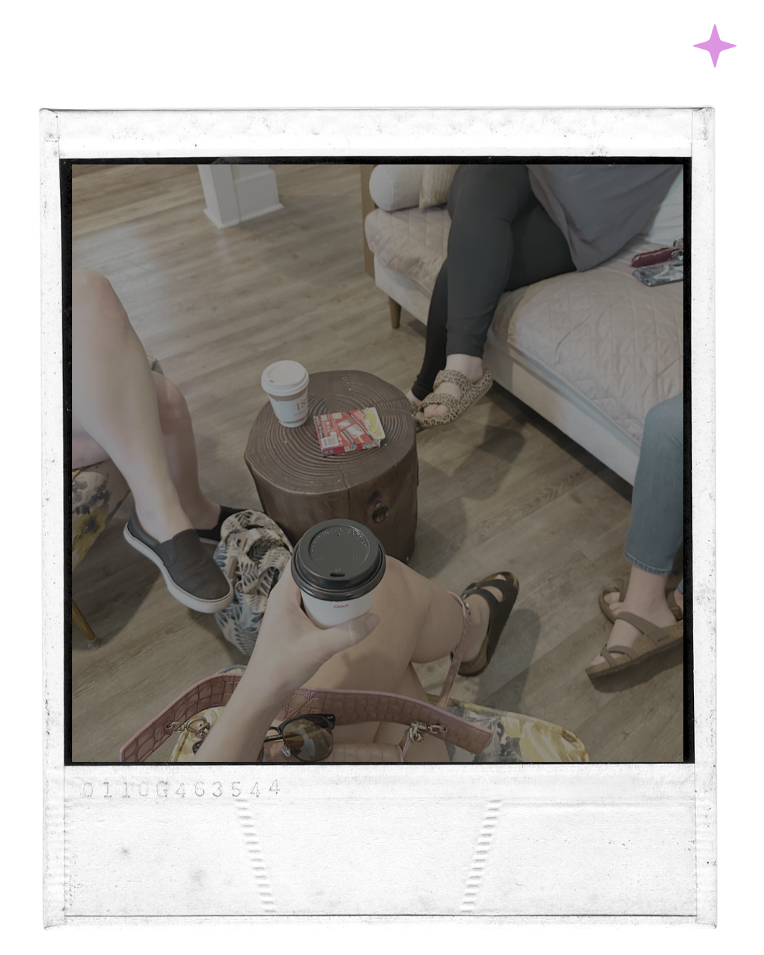 People sitting around a wood stump coffee table in a cozy cafe, holding coffee cups, with snacks on the table and wearing casual shoes.