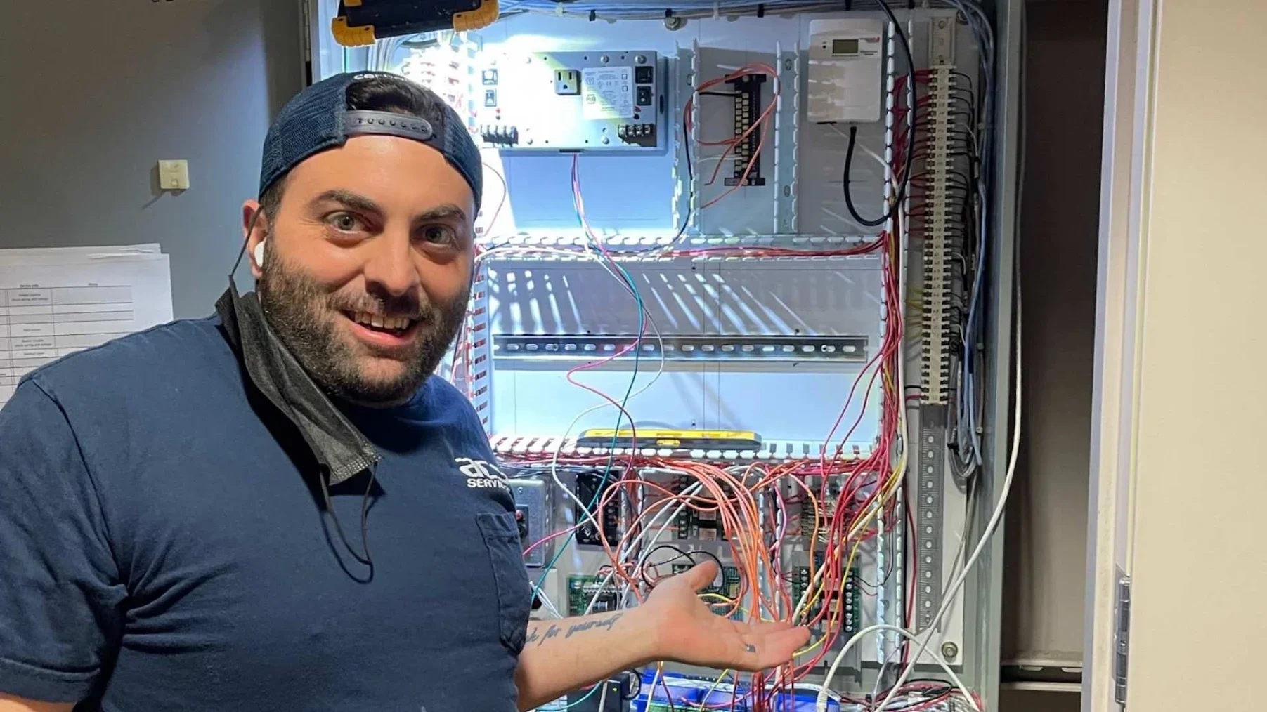 An ACS Services technician working in a commercial setting.