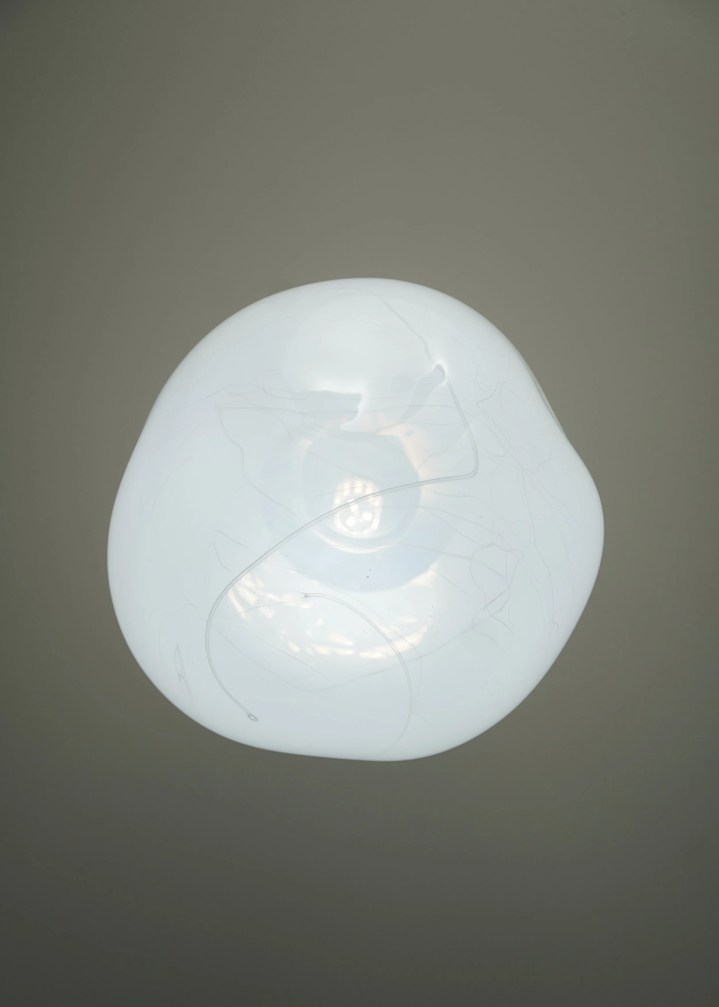 Silta
Silta draws from the subtle patterns left by nature — fine lines like those found in layered earth and sediment. Each light is shaped by hand, with markings unique to the making.