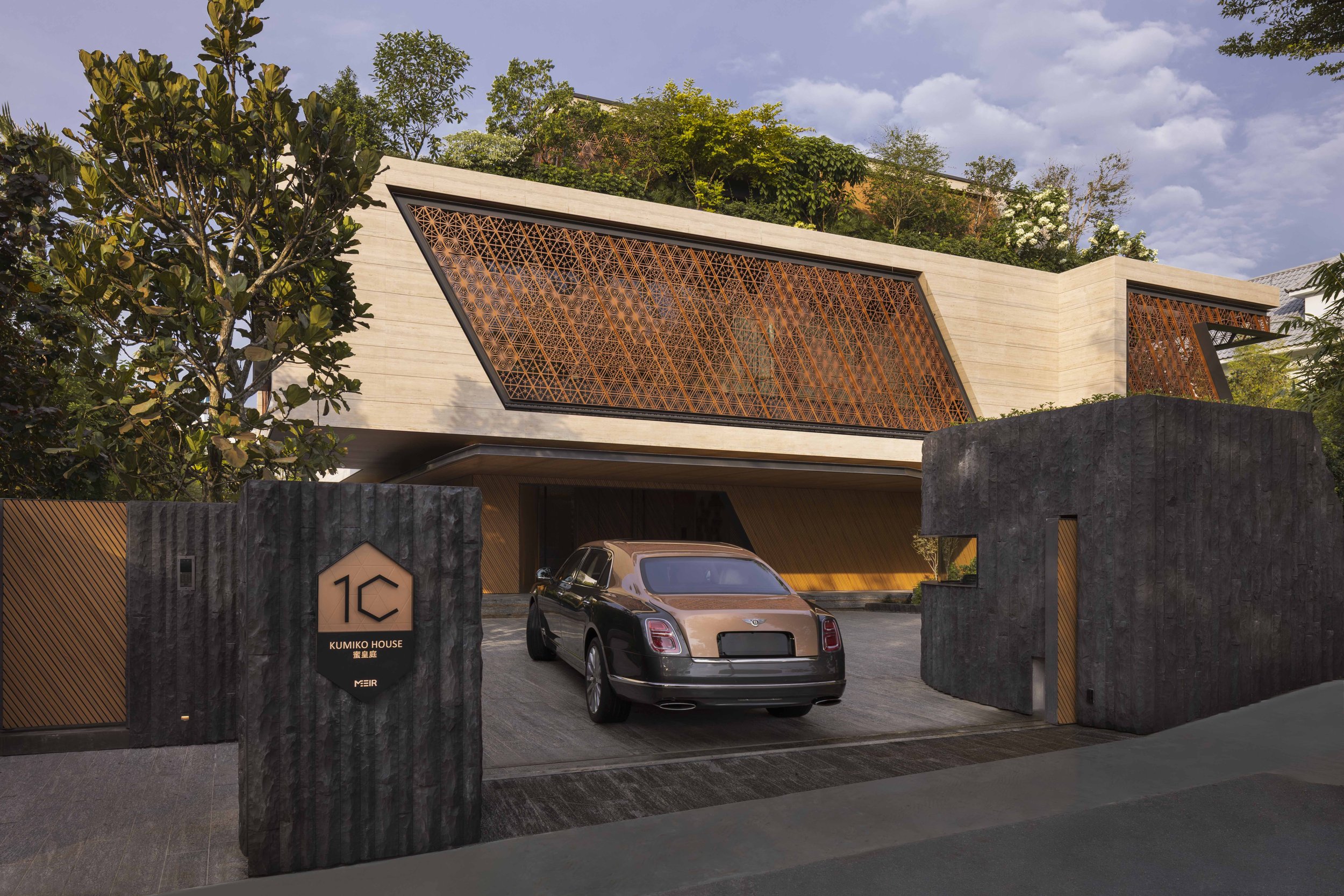 A Bentley entering a good class bungalow in Singapore