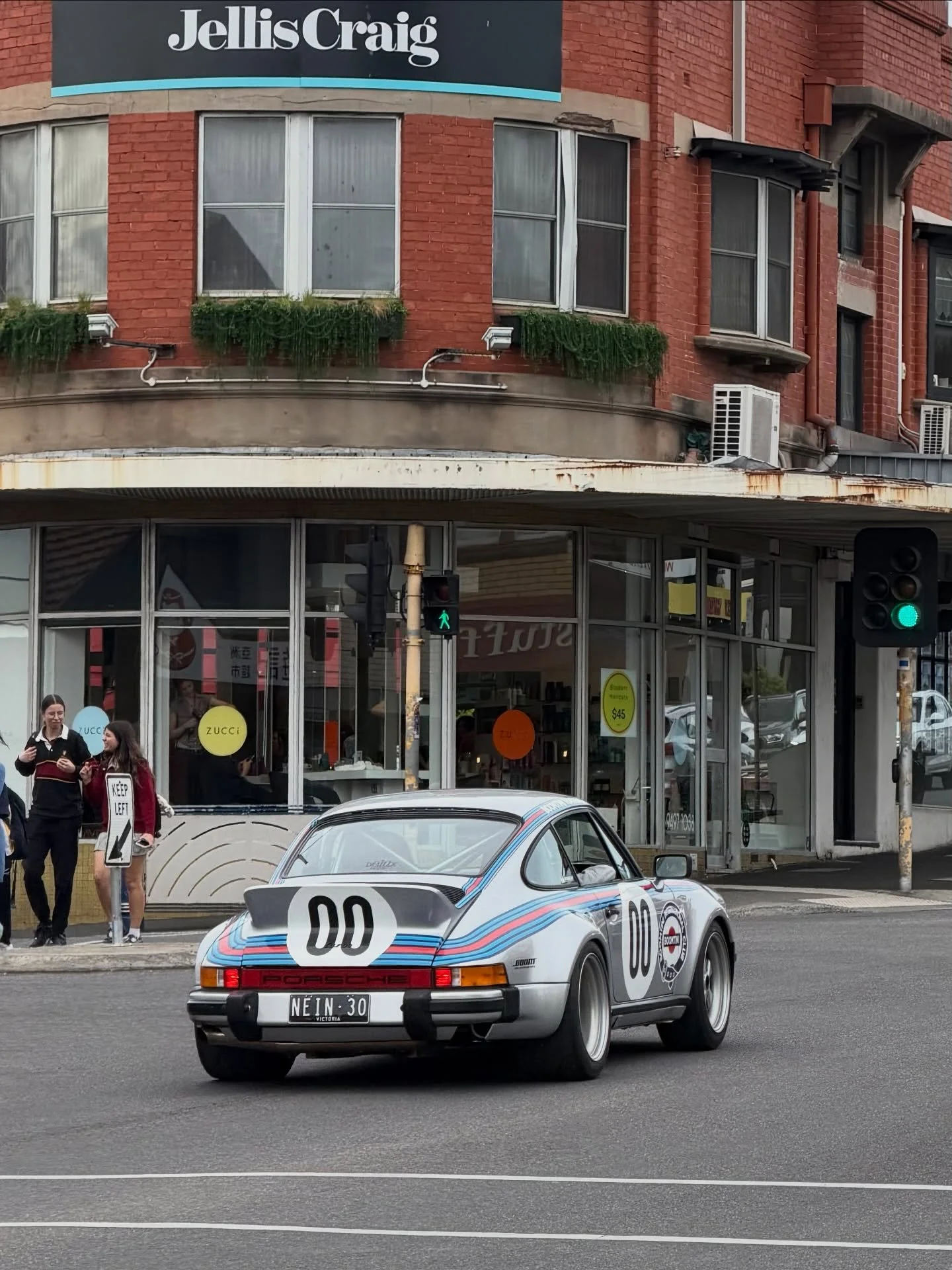 Spotted this afternoon in Ivanhoe, a self-proclaimed Porsche 911 hotrod - what began as a 1974 coupe is now a 930-spec build with a 3.4L turbo motor. Big boost and the rubber to suit. 

The new livery finishes it: Boomtini Racing, Bishelin, and Nobra