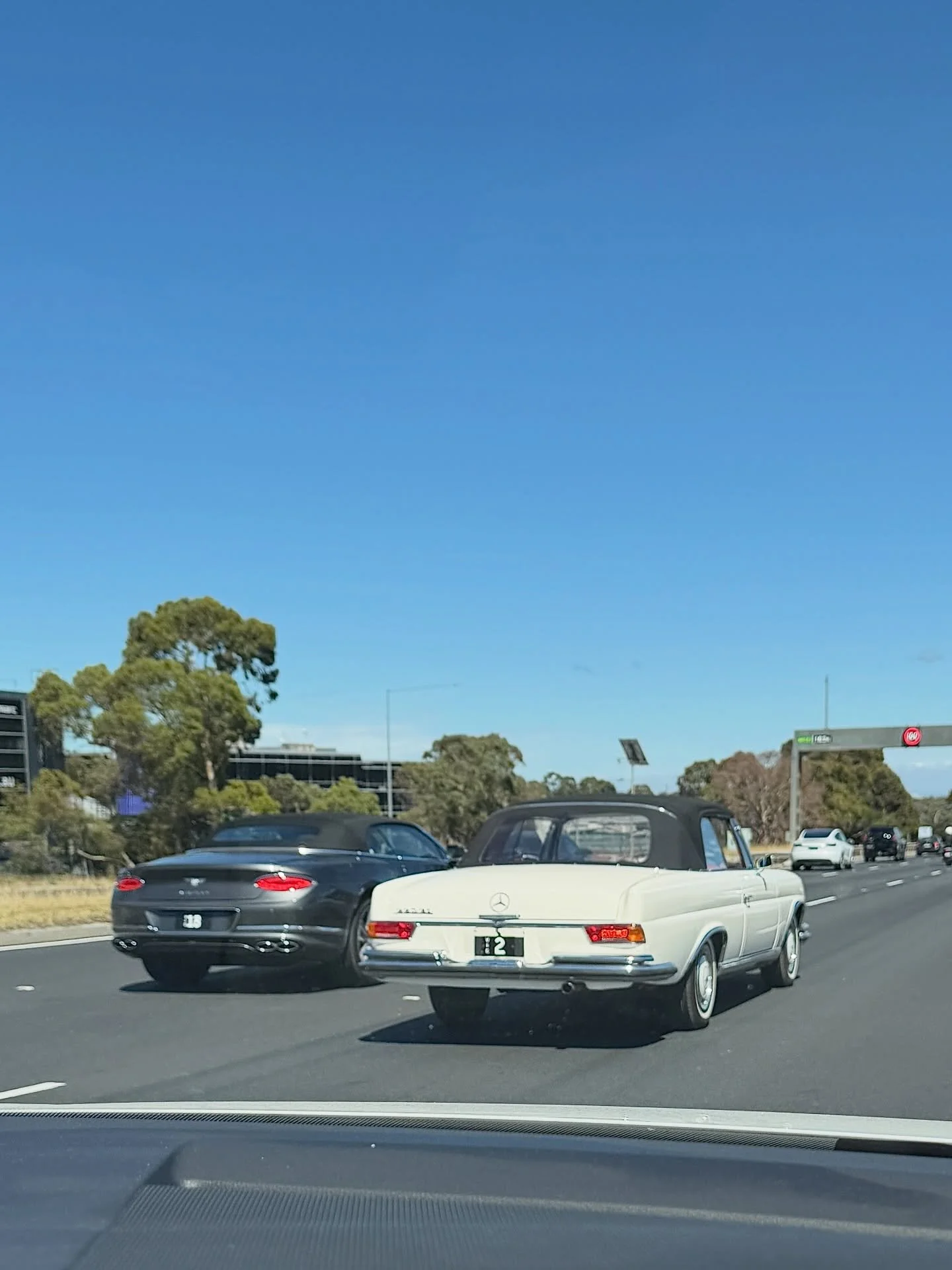 A gorgeous 1964 Mercedes-Benz 220SE Cabriolet and Bentley Continental GTC on the Monash Fwy with a couple of the most sought after number plates in Victoria. 

Interestingly, VIC [2] recently changed hands for an estimated $10 million. 

Epic spottin