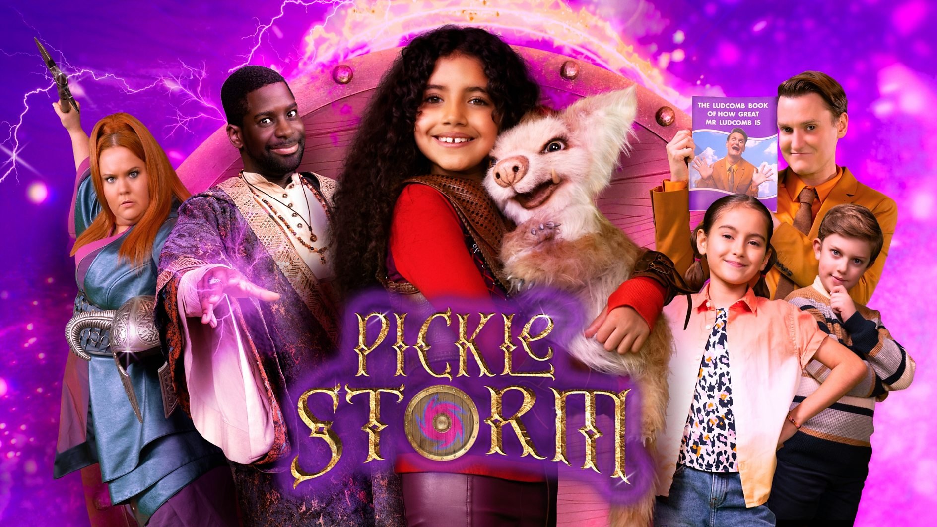 A young girl in a red top with dark hair is hugging a furry creature. Other friends are in the background. The text 'Pickle Storm' is in gold letters with a purple highlight and a shield fills the middle of the letter 'o'.